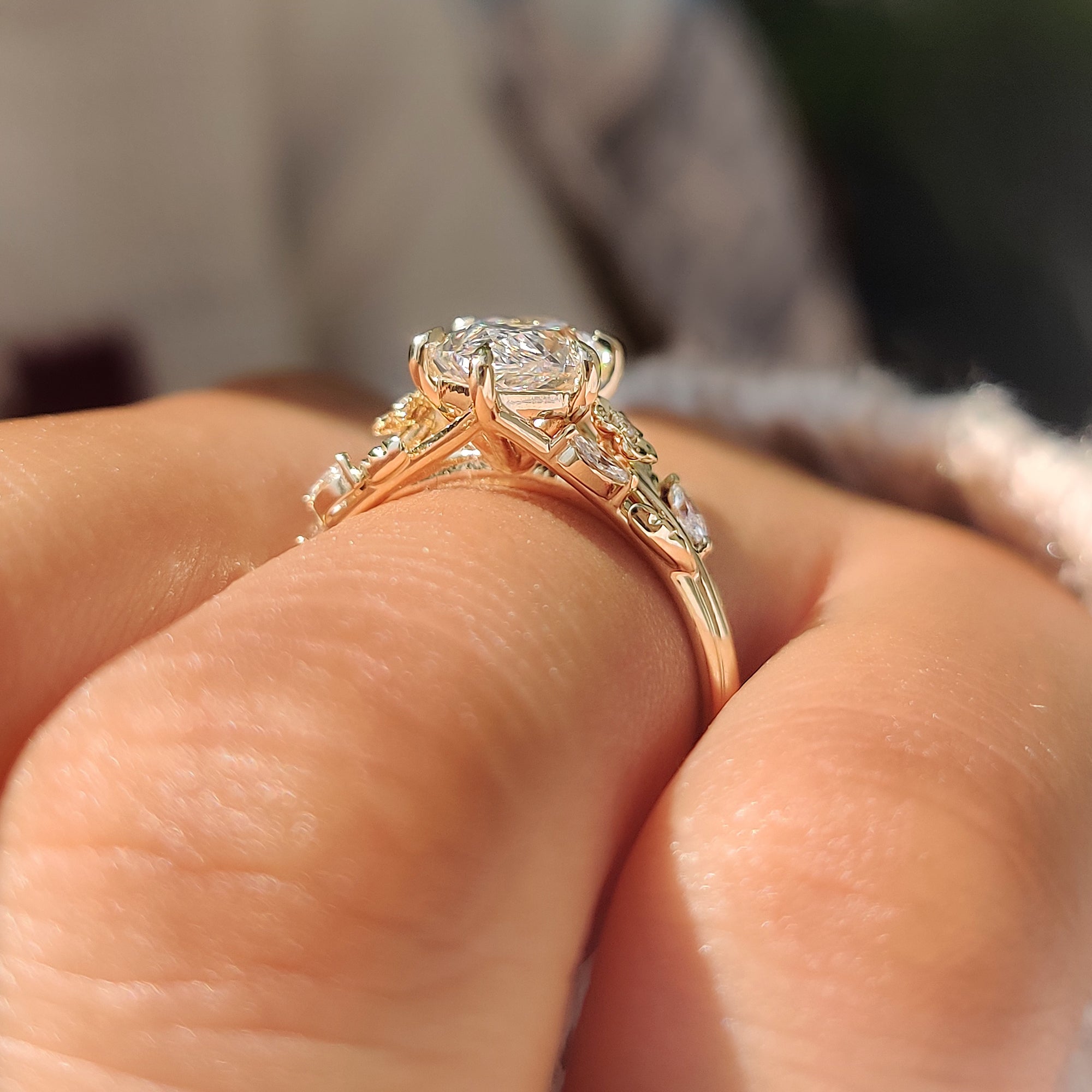 Six claw prong setting securing the Dutch marquise center diamond.
