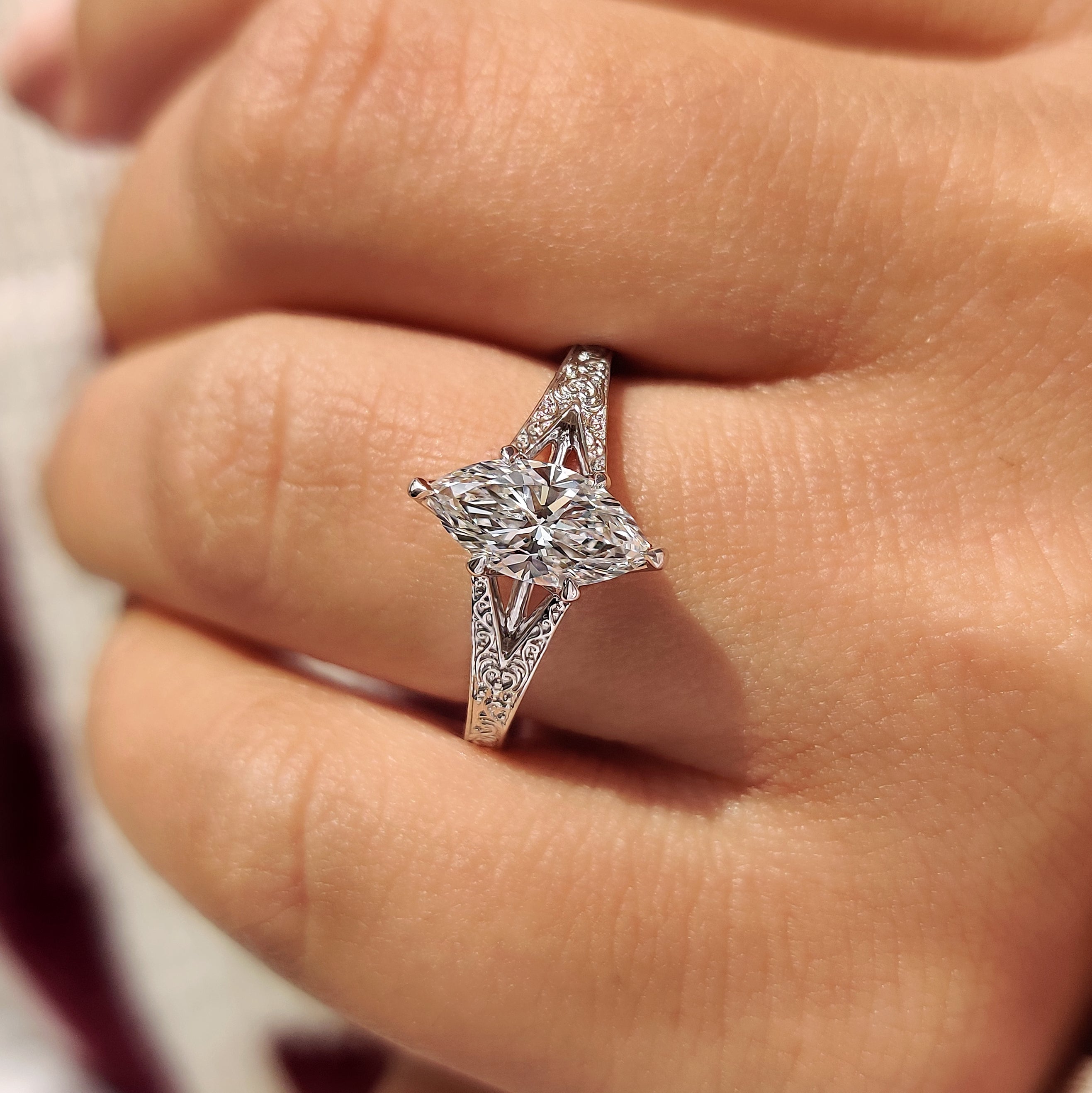Marquise diamond ring with six claw tulip style setting.
