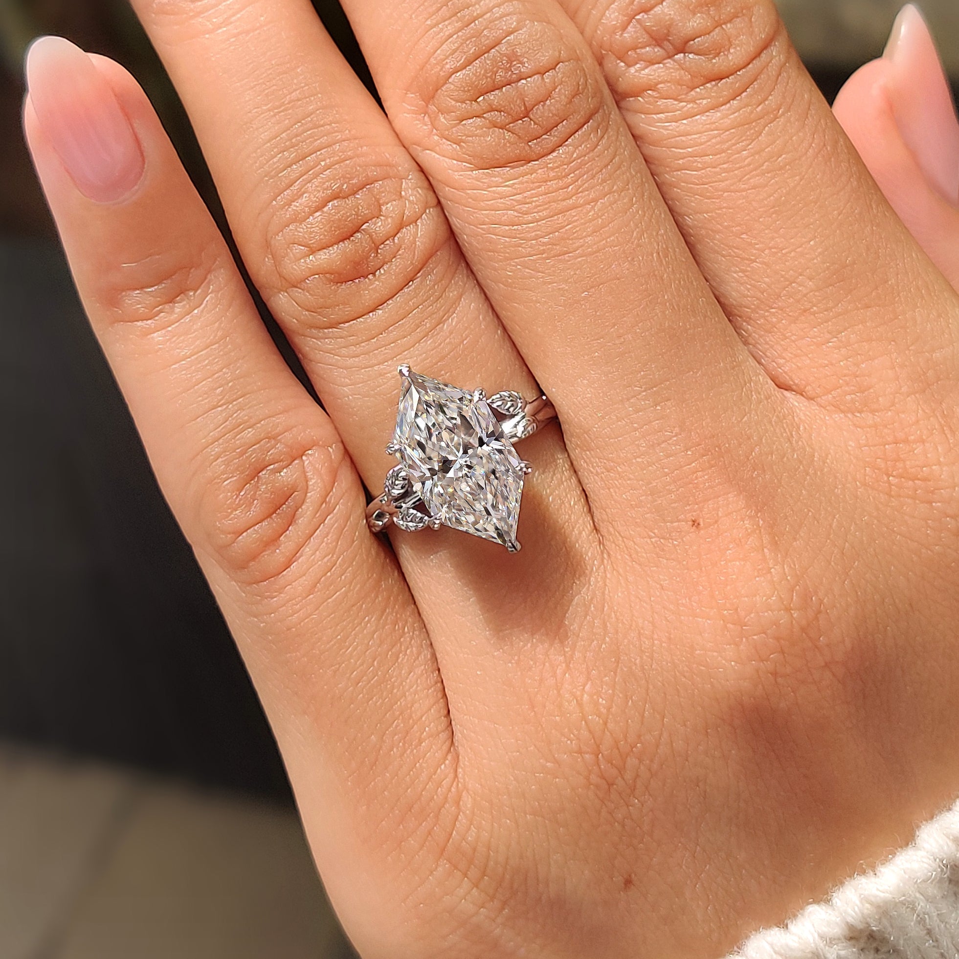 Twisted shank solitaire ring with Dutch marquise diamond
