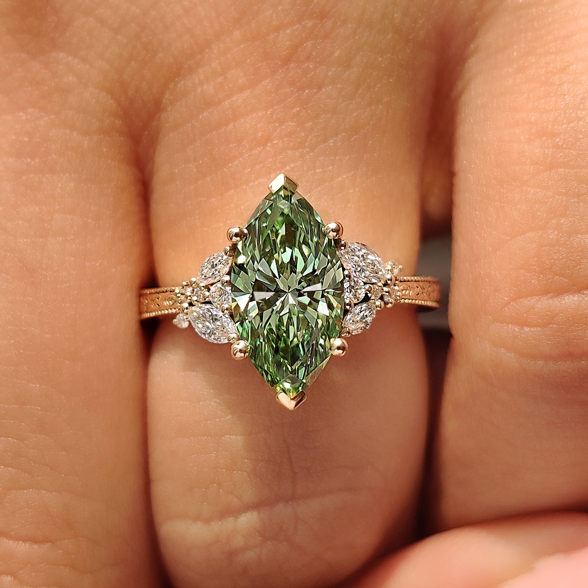 Milgrain green marquise ring with floral band.
