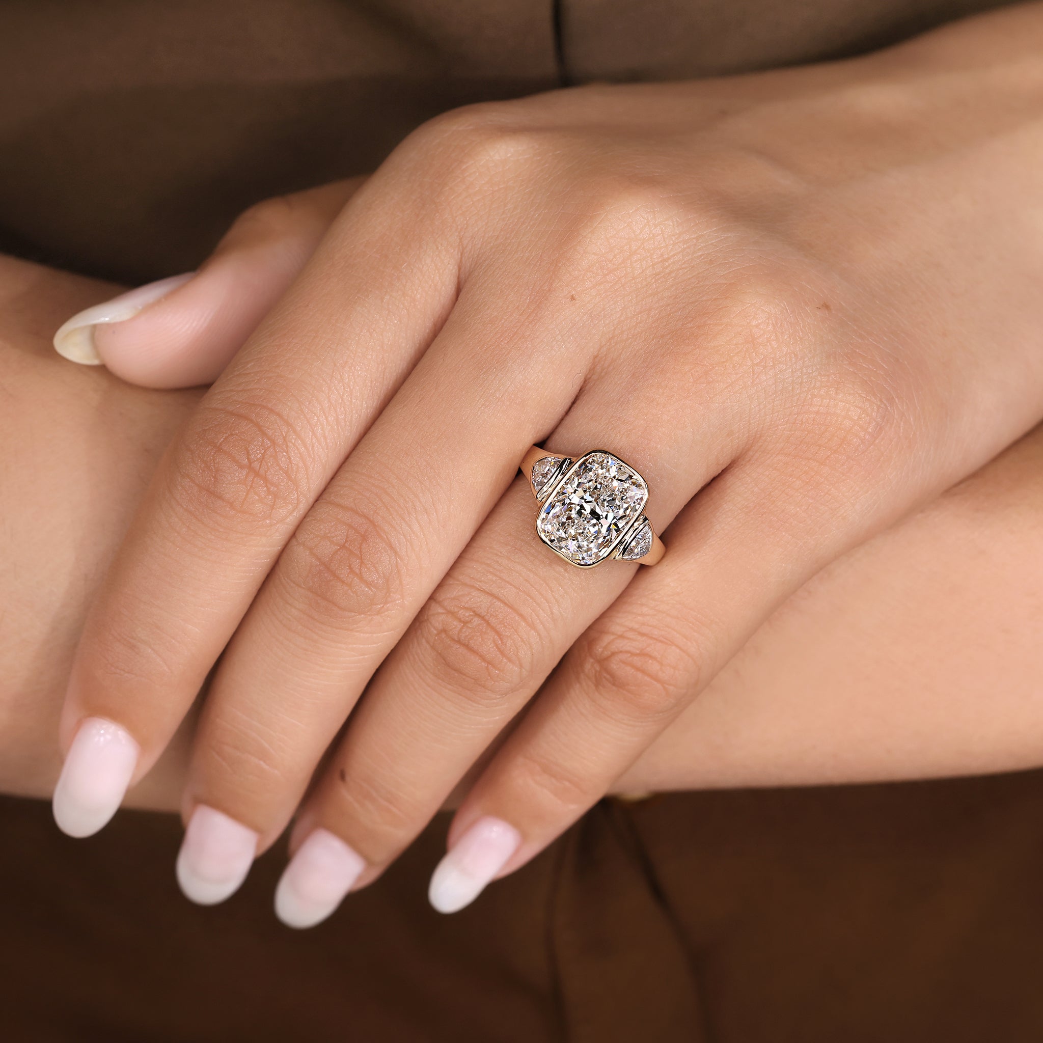 Carat Diamonds elongated cushion cut ring with three stone layout

