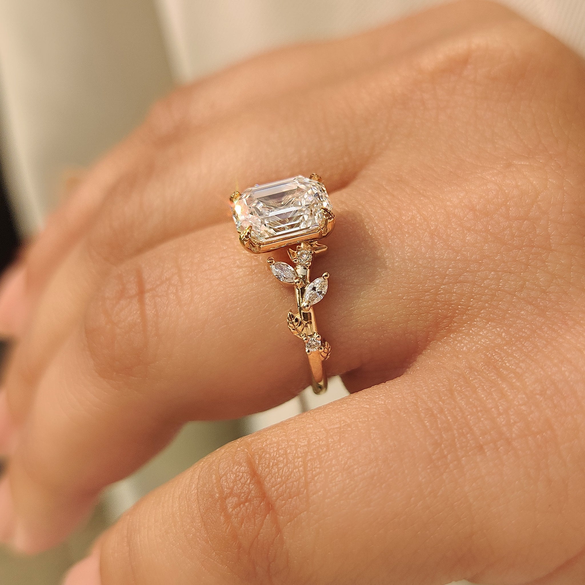 Nature inspired ring with round and marquise side stones
