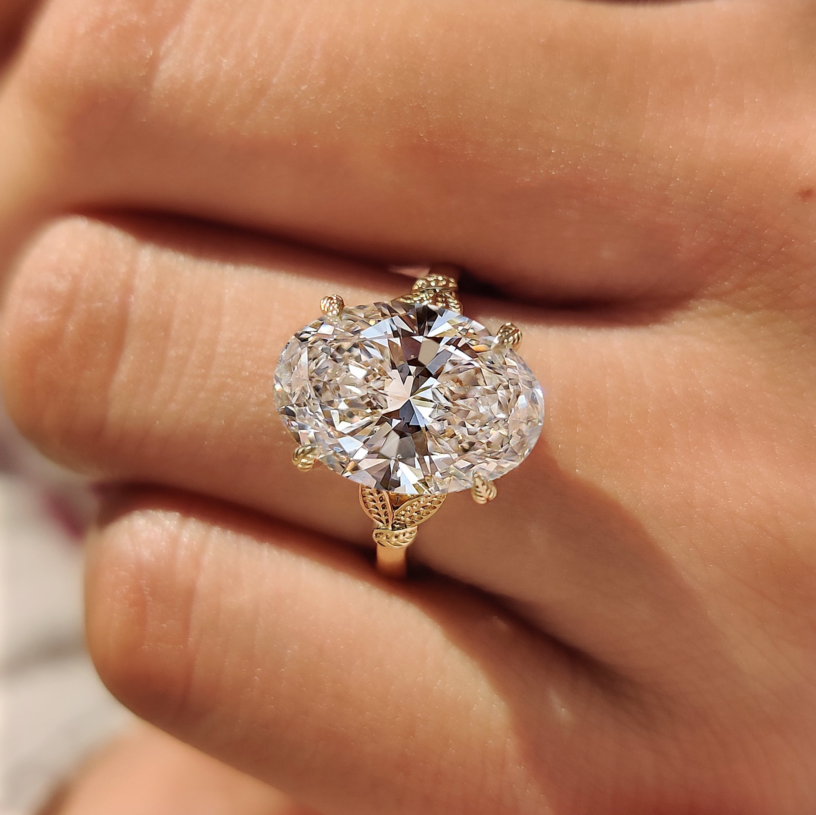 Round hidden halo solitaire engagement ring
