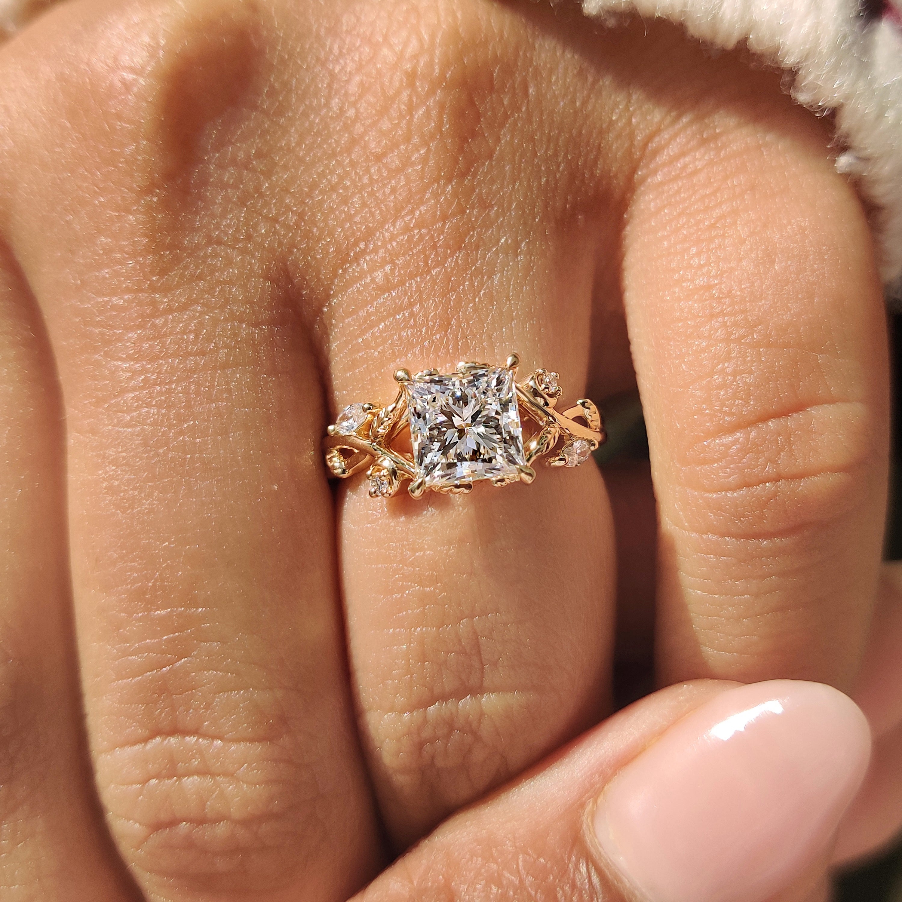 Handmade princess cut ring with leaf style design.
