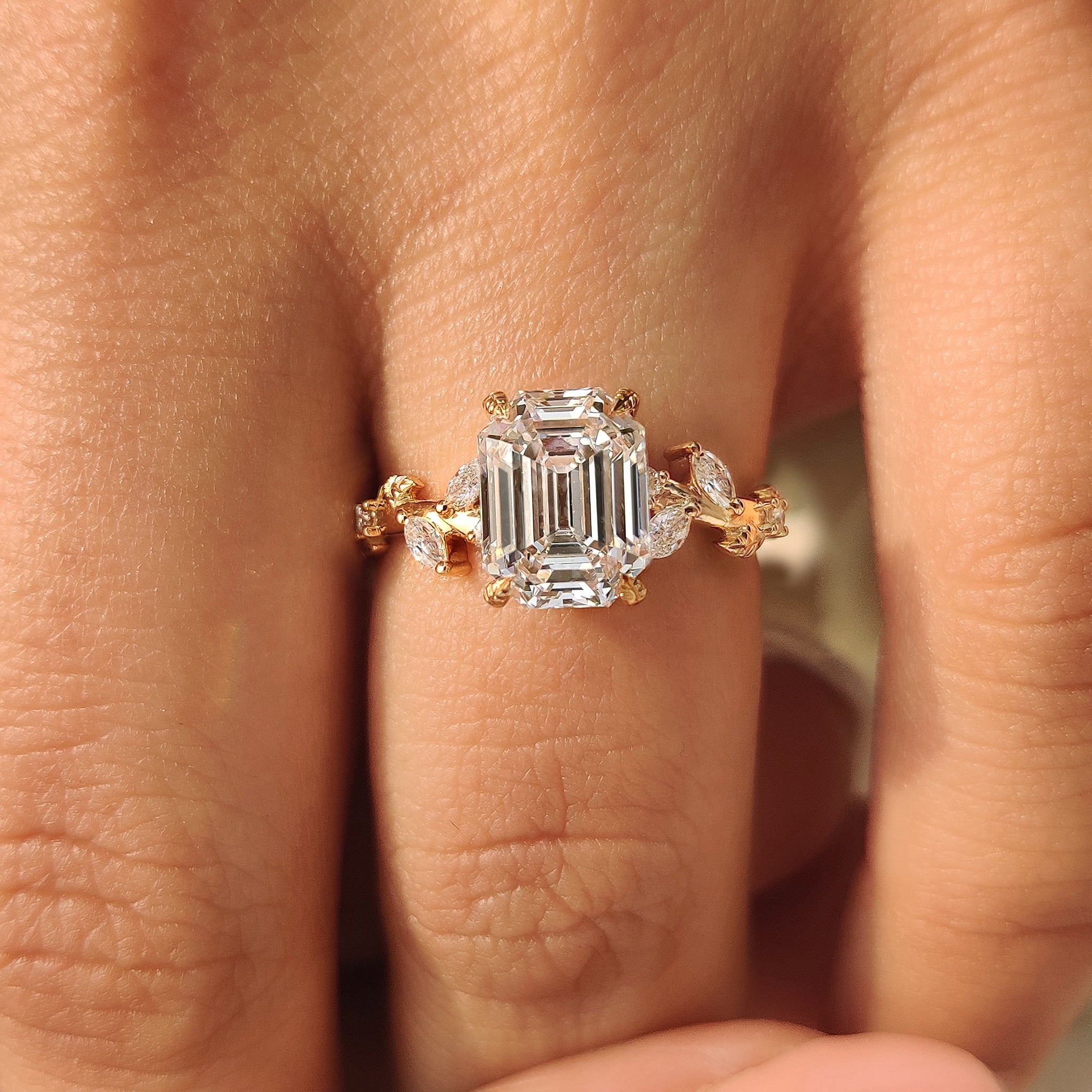 Old mine emerald cut diamond ring with marquise accents
