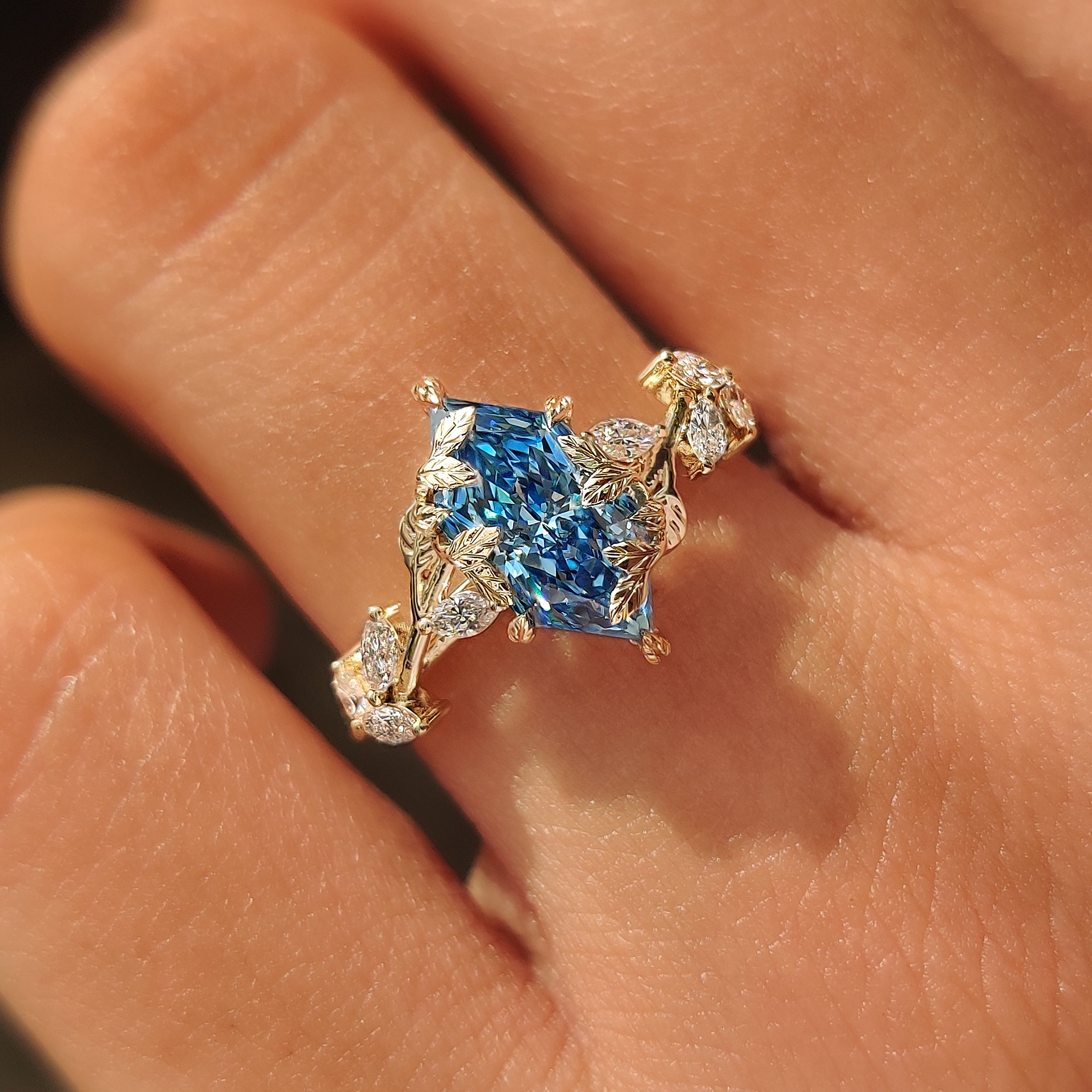 Handmade Dutch marquise ring with botanical gold detailing.

