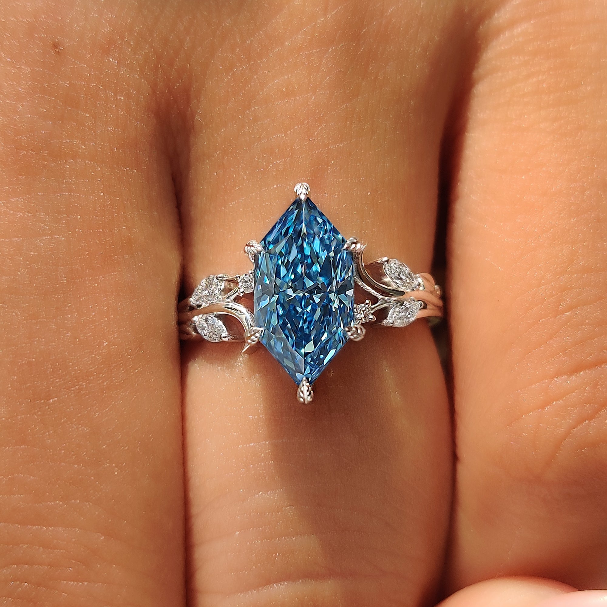 Leaf and vine details on nature inspired engagement ring.
