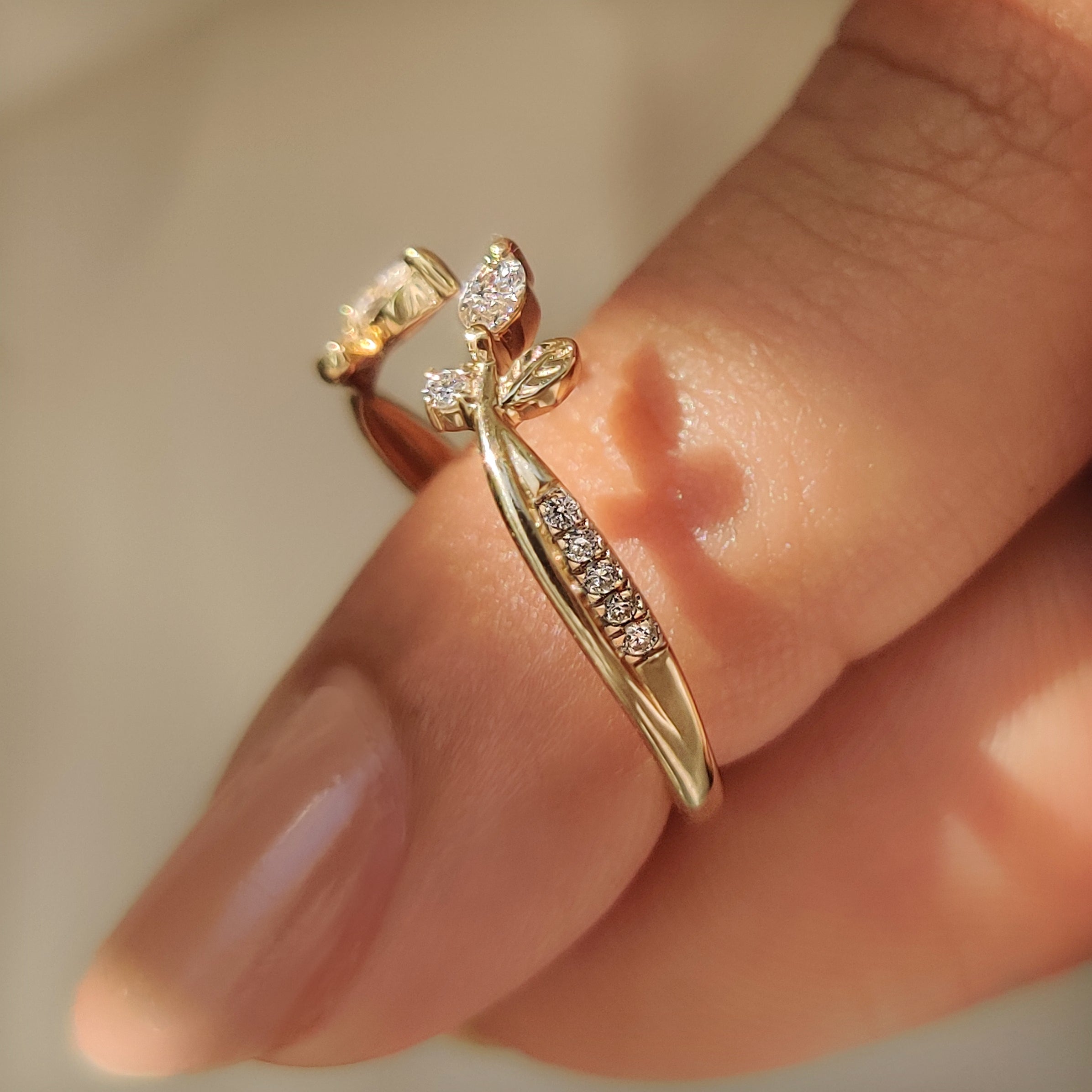 Handmade stackable band with marquise and round diamond accents.

