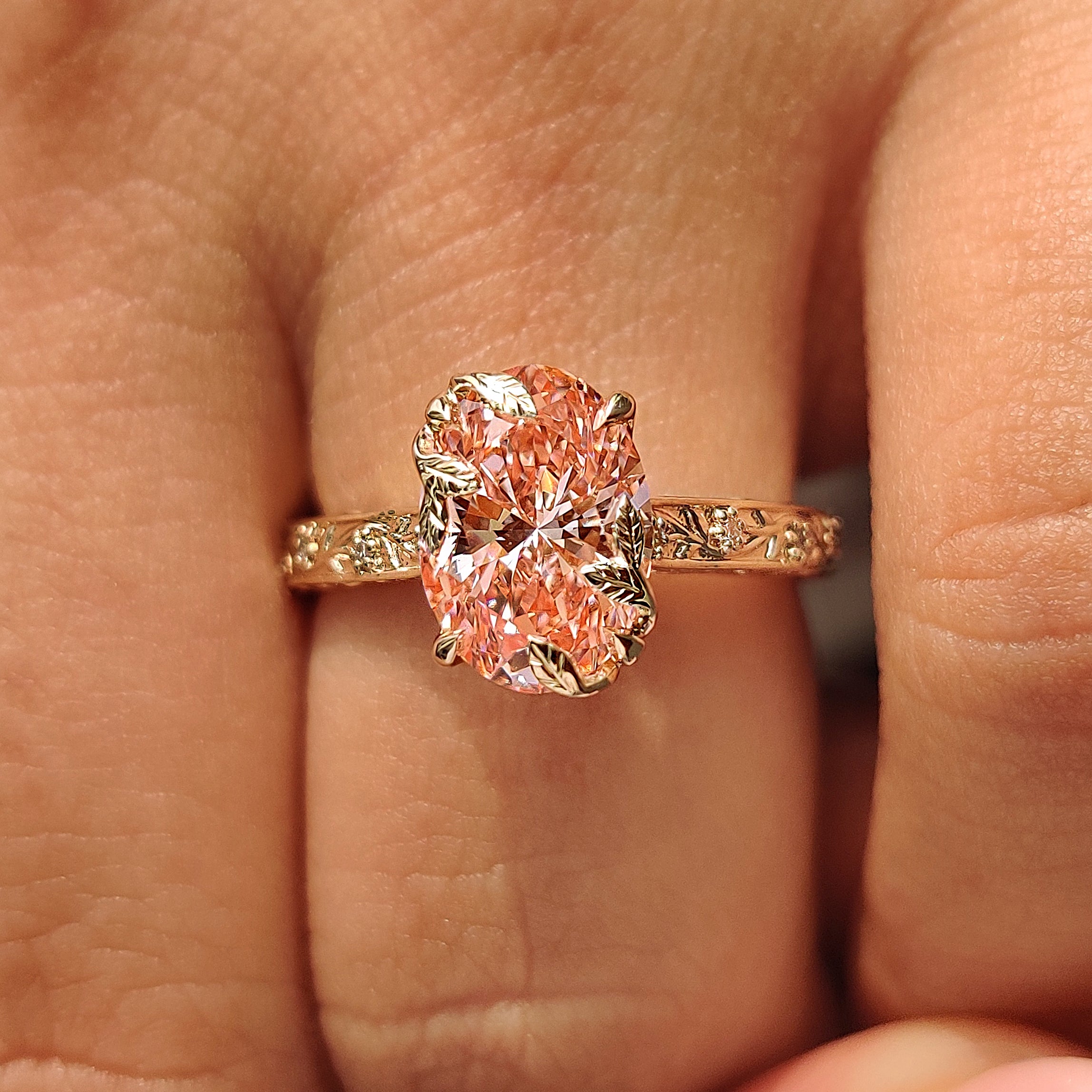 Vintage inspired pink oval diamond ring with filigree.
