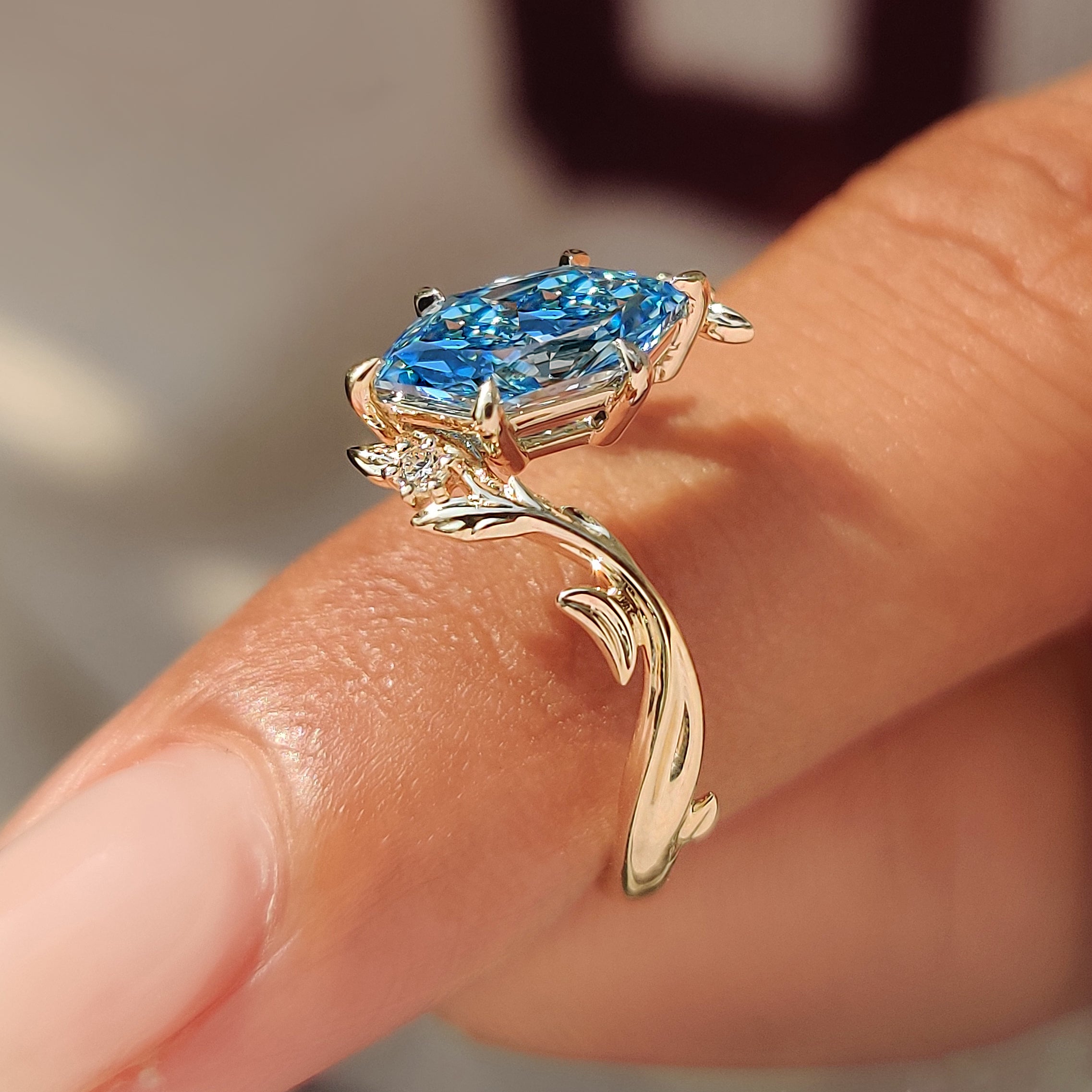 Nature inspired engagement ring with diamond set leaf details.

