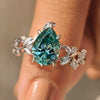 Nature inspired ring with cyan blue moissanite pear stone
