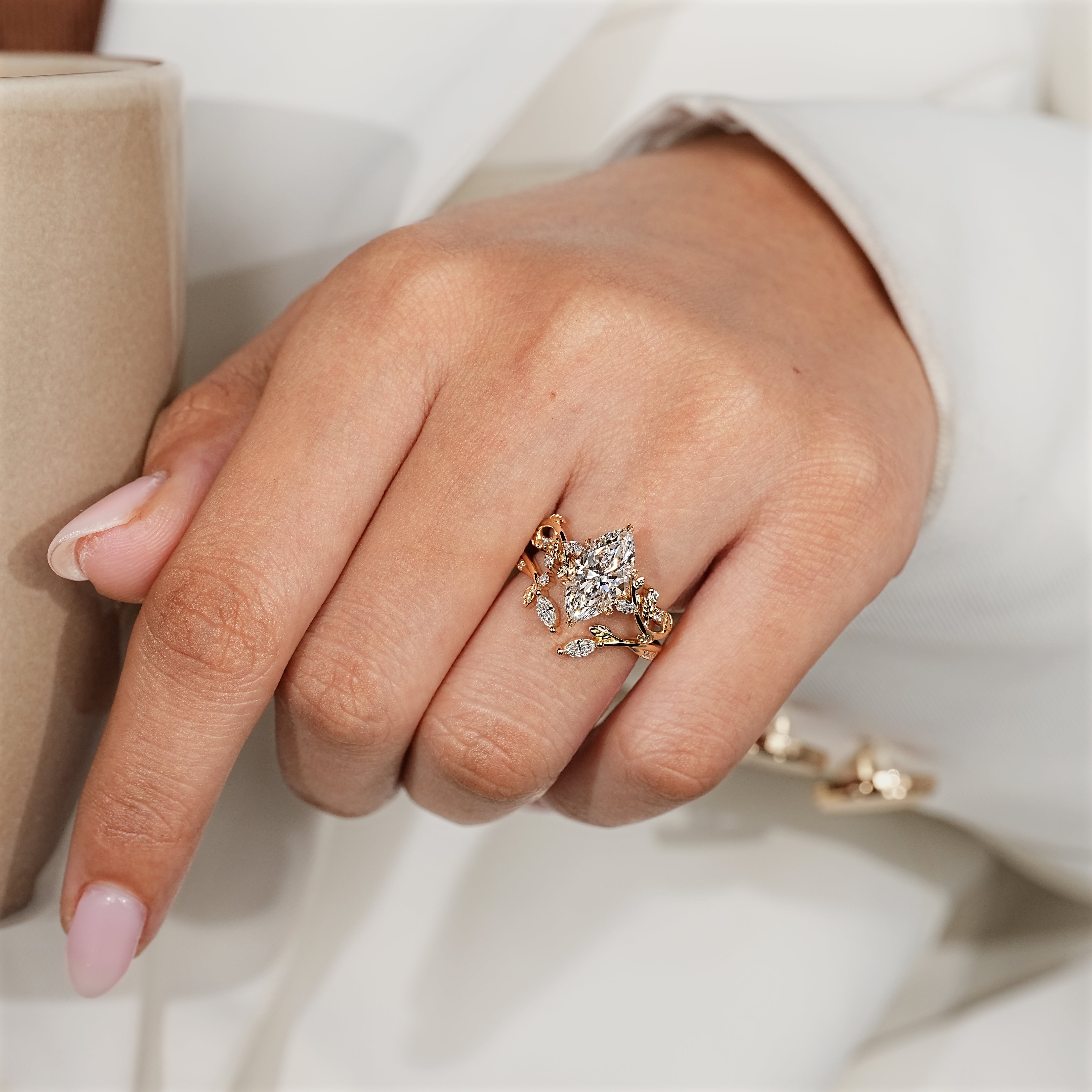 Marquise center diamond and round side stones on bridal set
