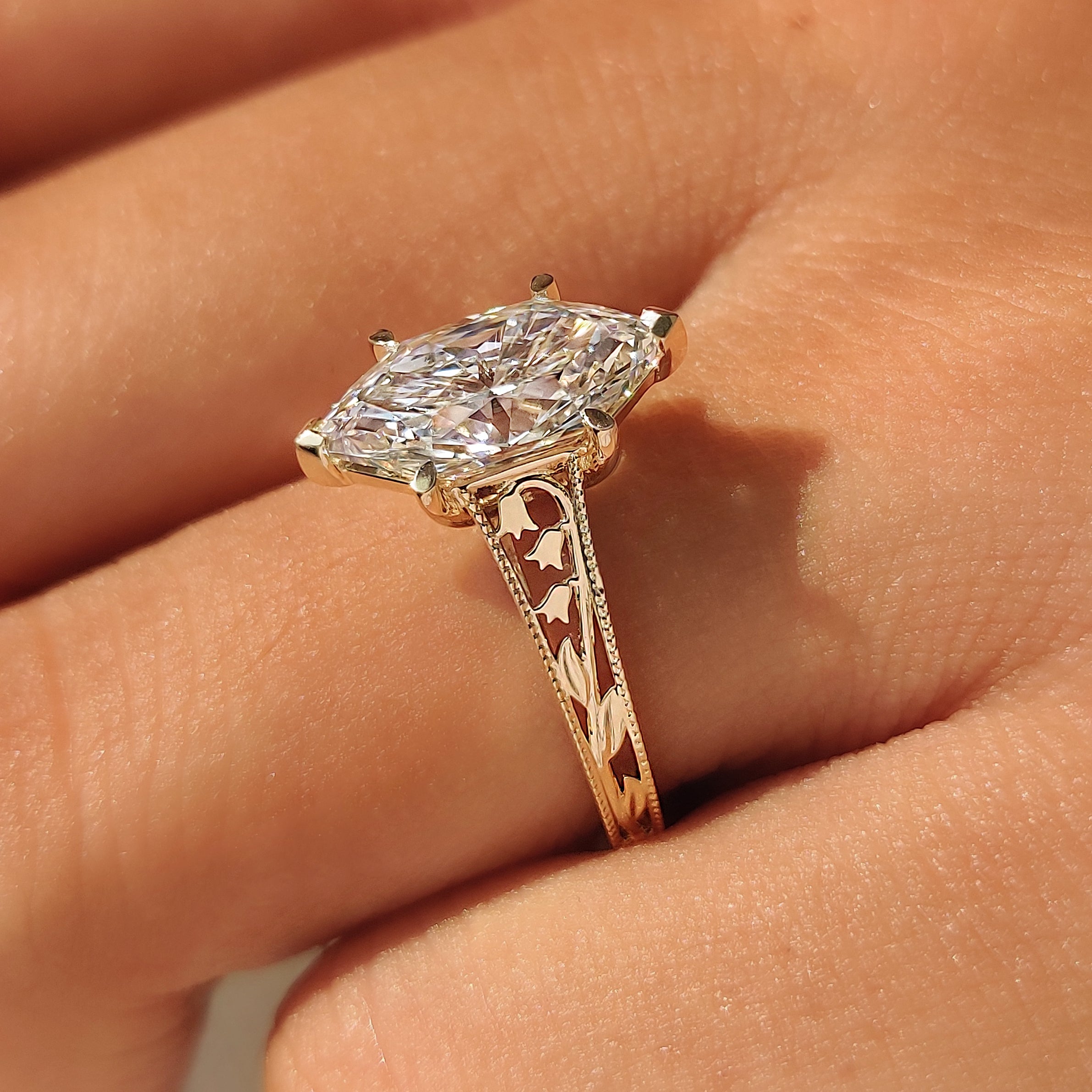 Lily of the valley flower design on a Dutch marquise ring.
