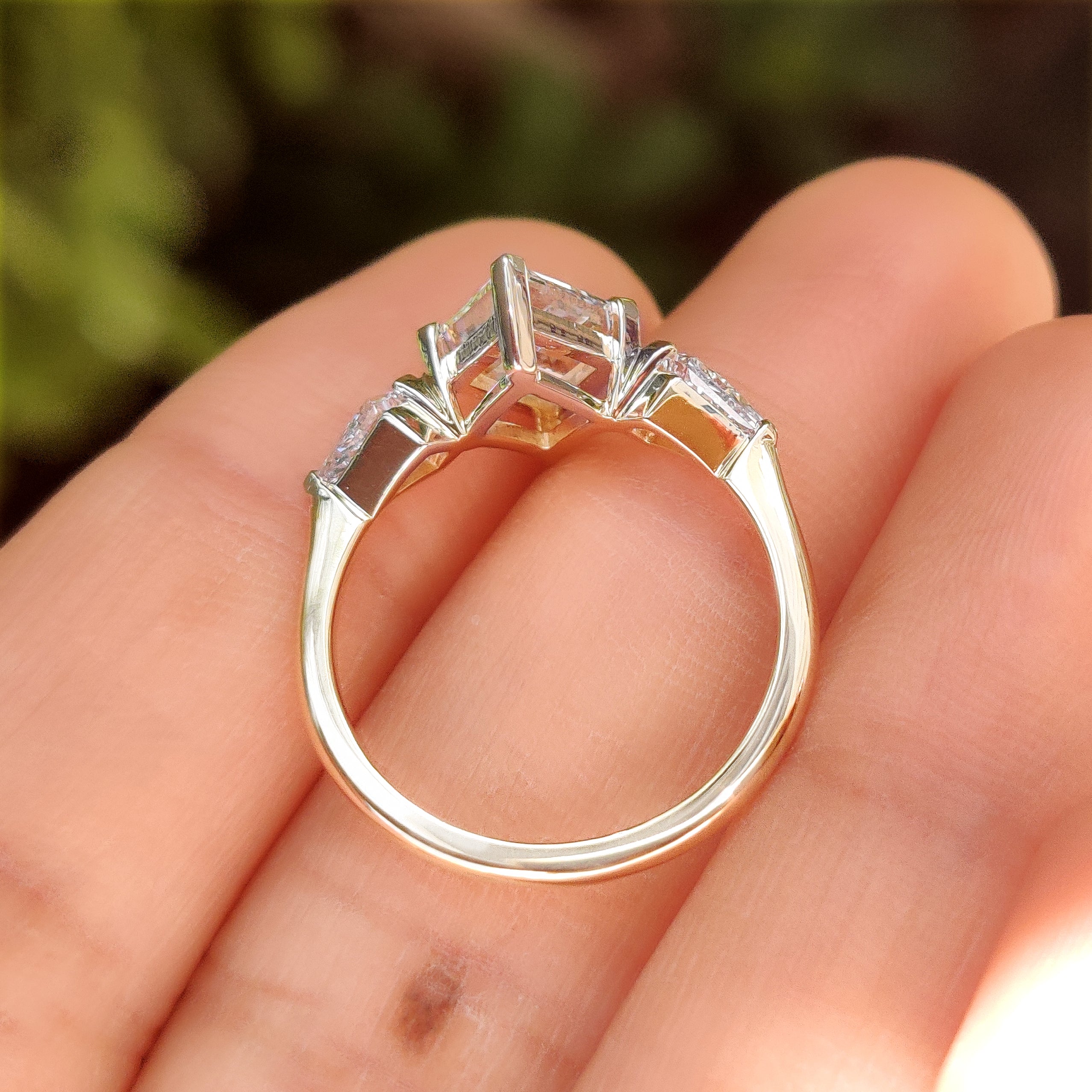 Lab grown lozenge diamond ring with three stone style
