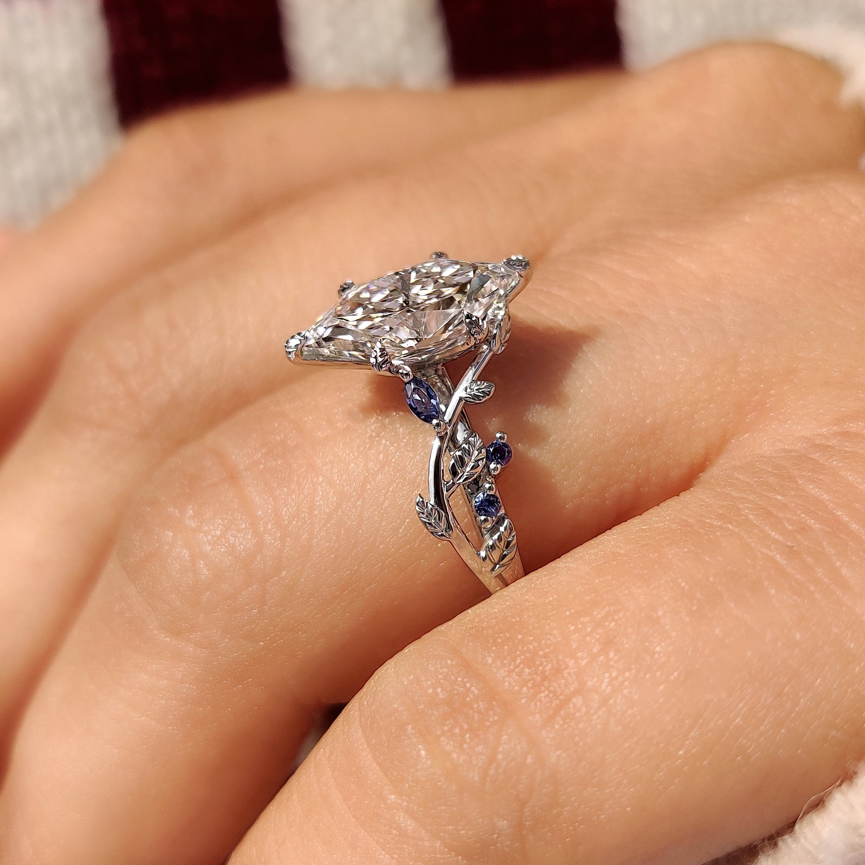 Dutch marquise ring with marquise and round side stones
