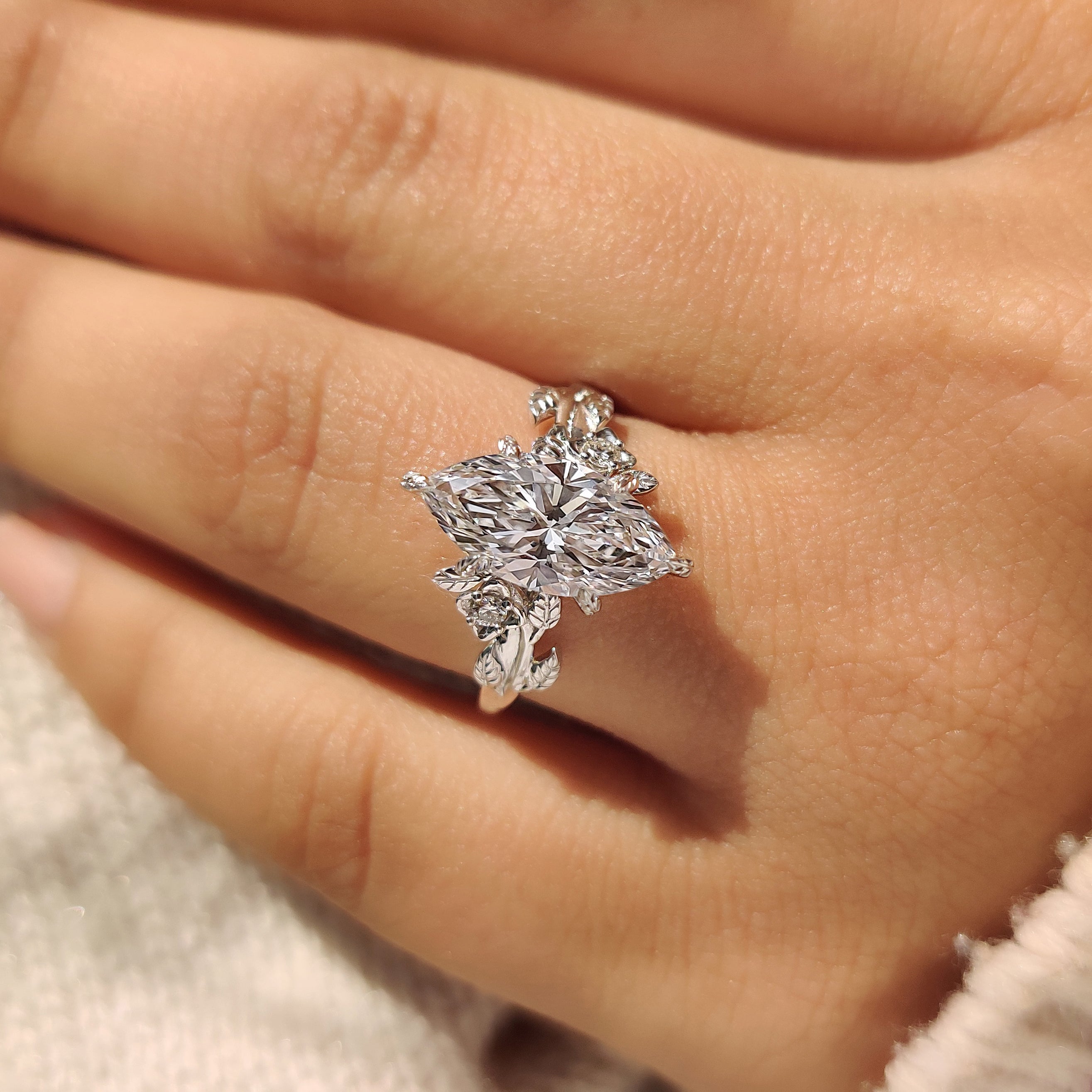 IGI certified marquise diamond ring with cluster setting style.
