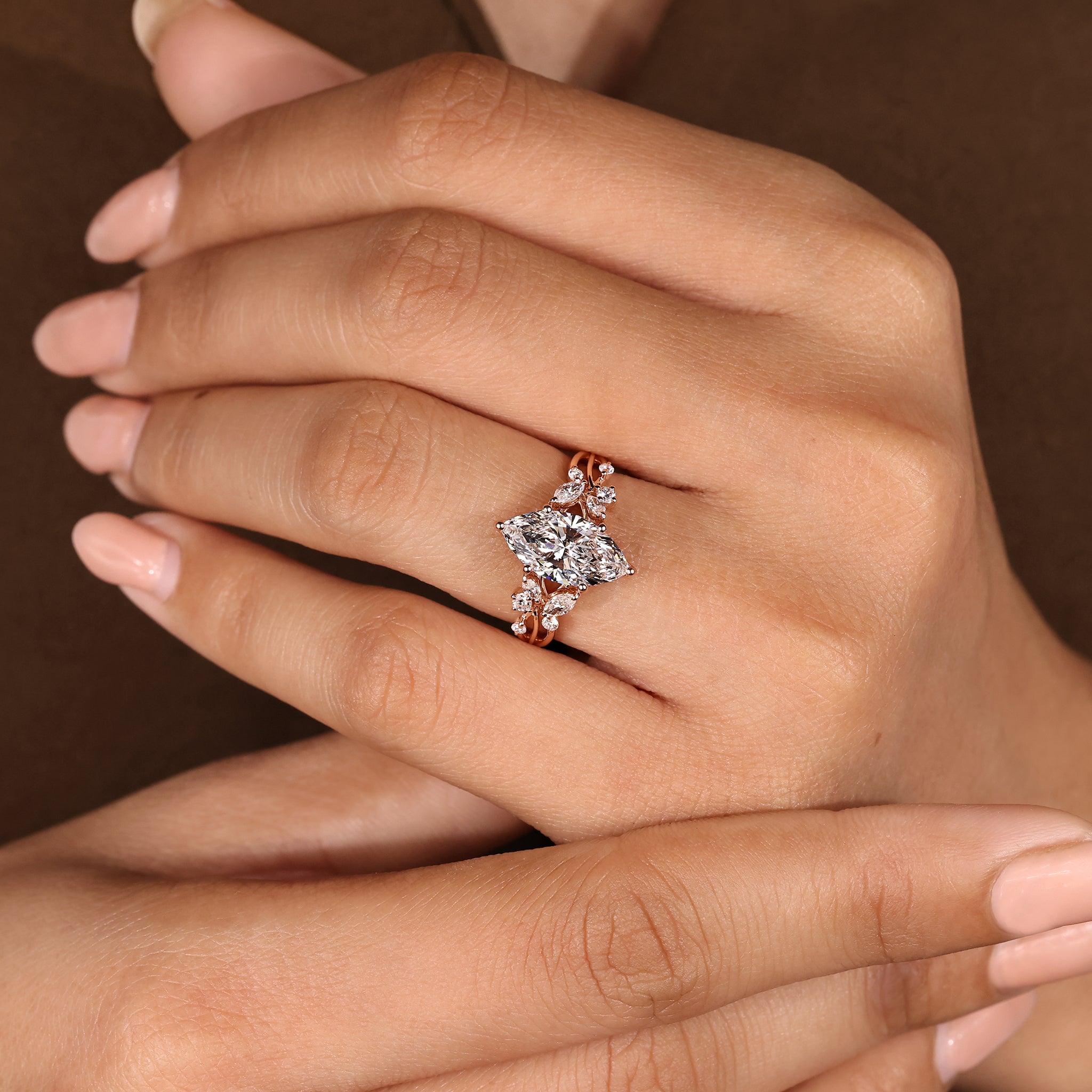 Marquise diamond ring with marquise and round side stones
