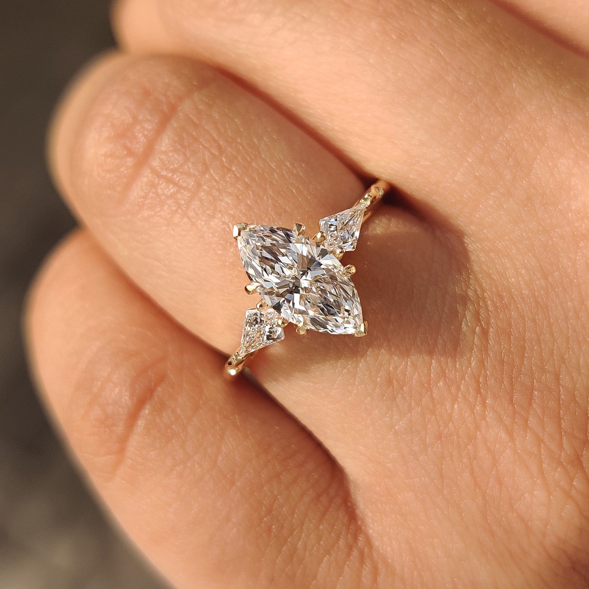 Marquise diamond ring featuring filigree basket setting
