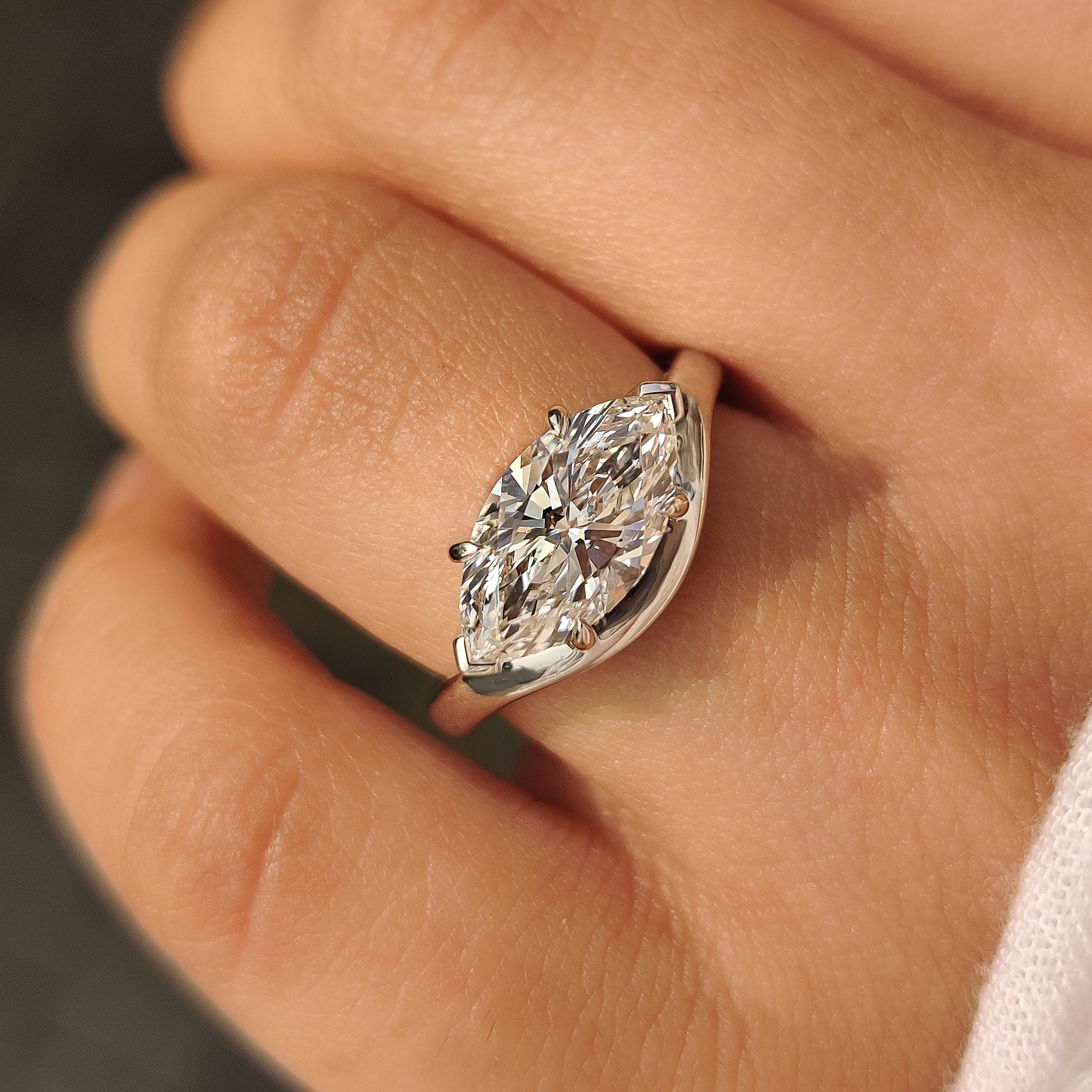 Marquise diamond engagement ring with two V prong setting
