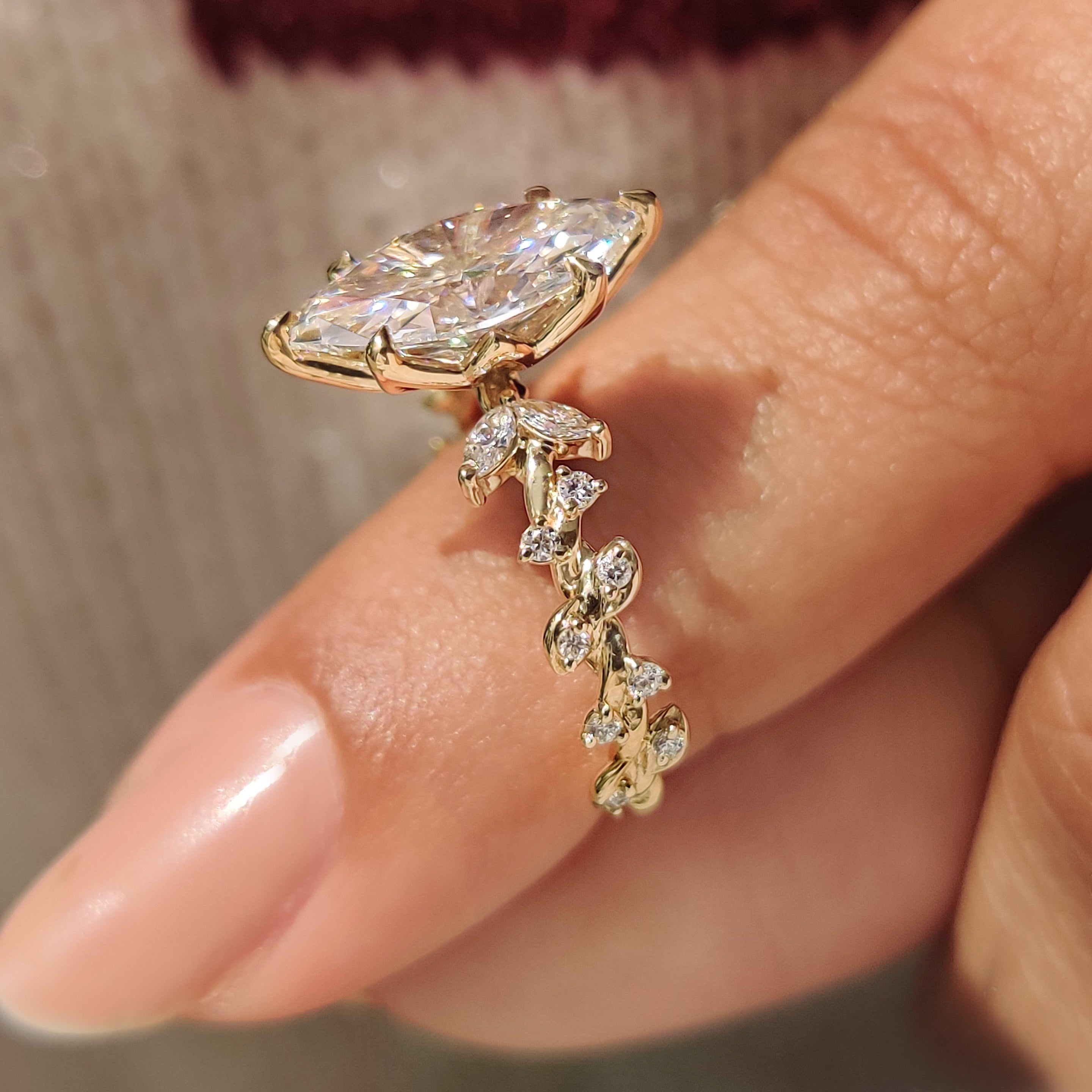 Cluster marquise ring with twisted shank and side stones.
