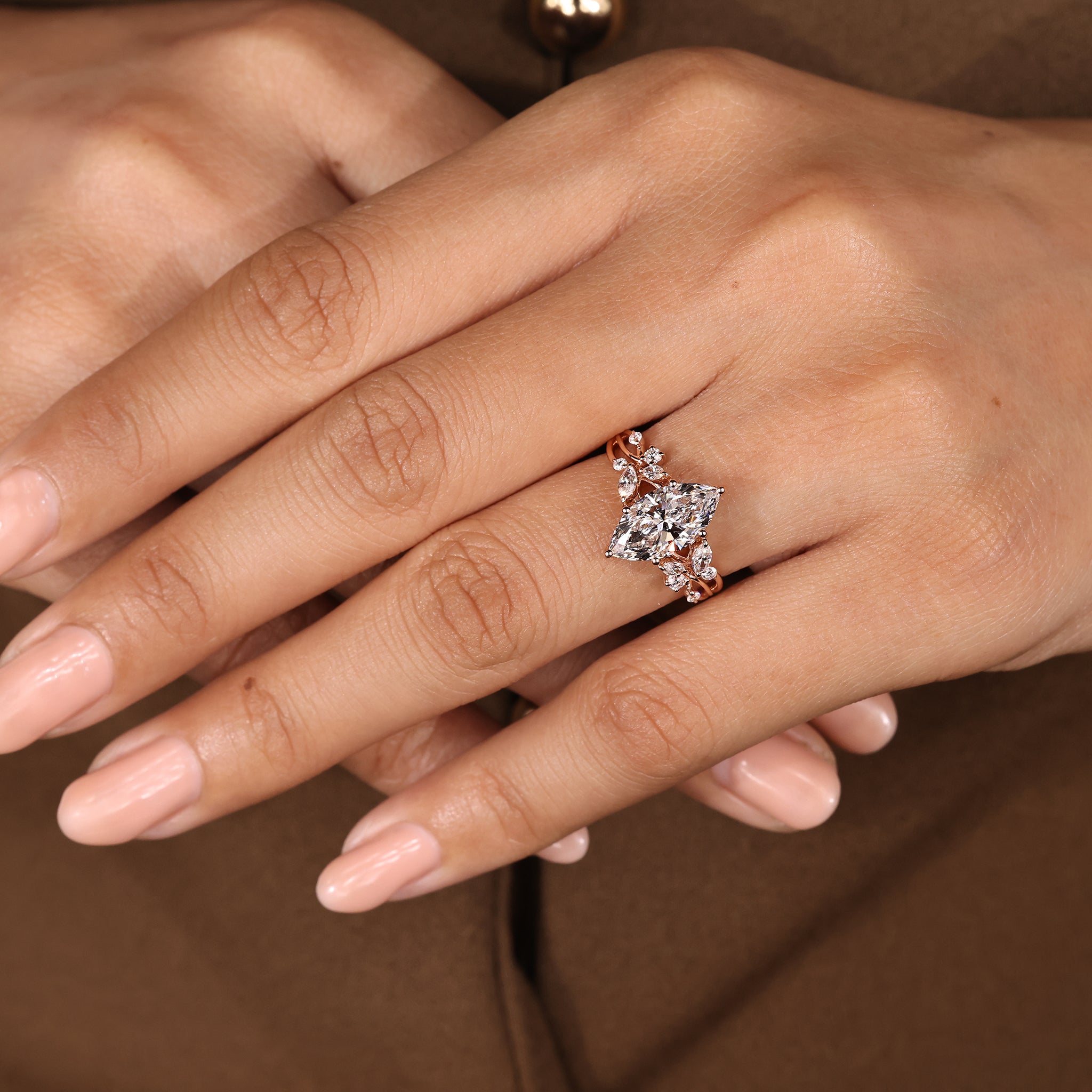 Carat Diamonds marquise diamond ring with side stones
