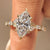 Marquise diamond engagement ring with leaf details.
