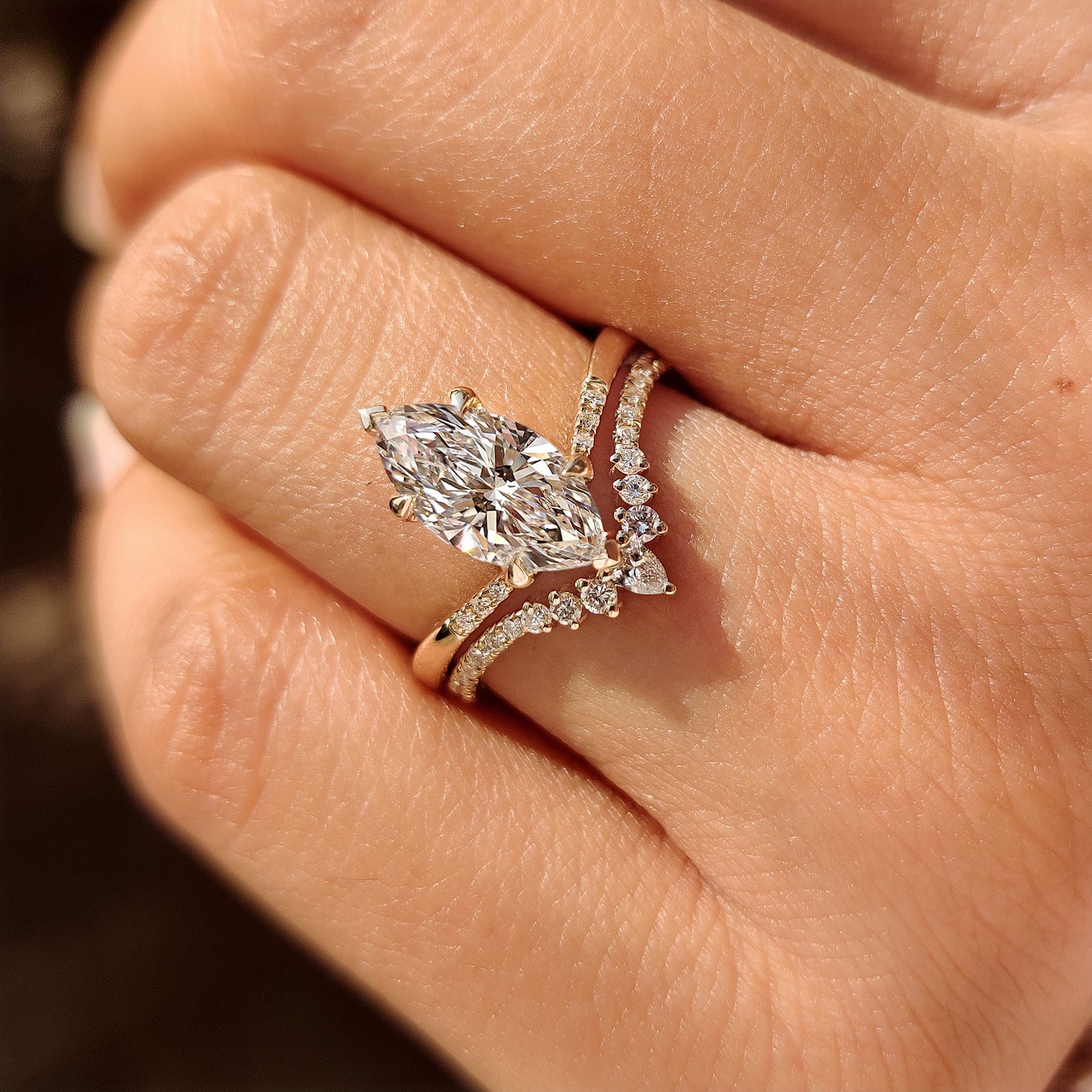 Marquise ring with round side stones tapered.
