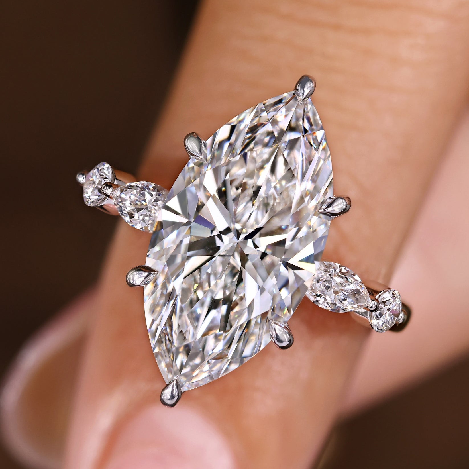 Marquise diamond ring with five stone design and round side stones
