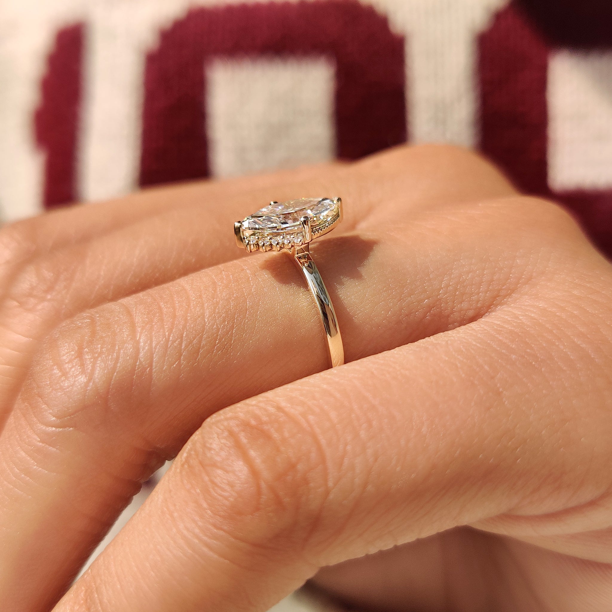 Marquise diamond ring with two V shaped prong setting.
