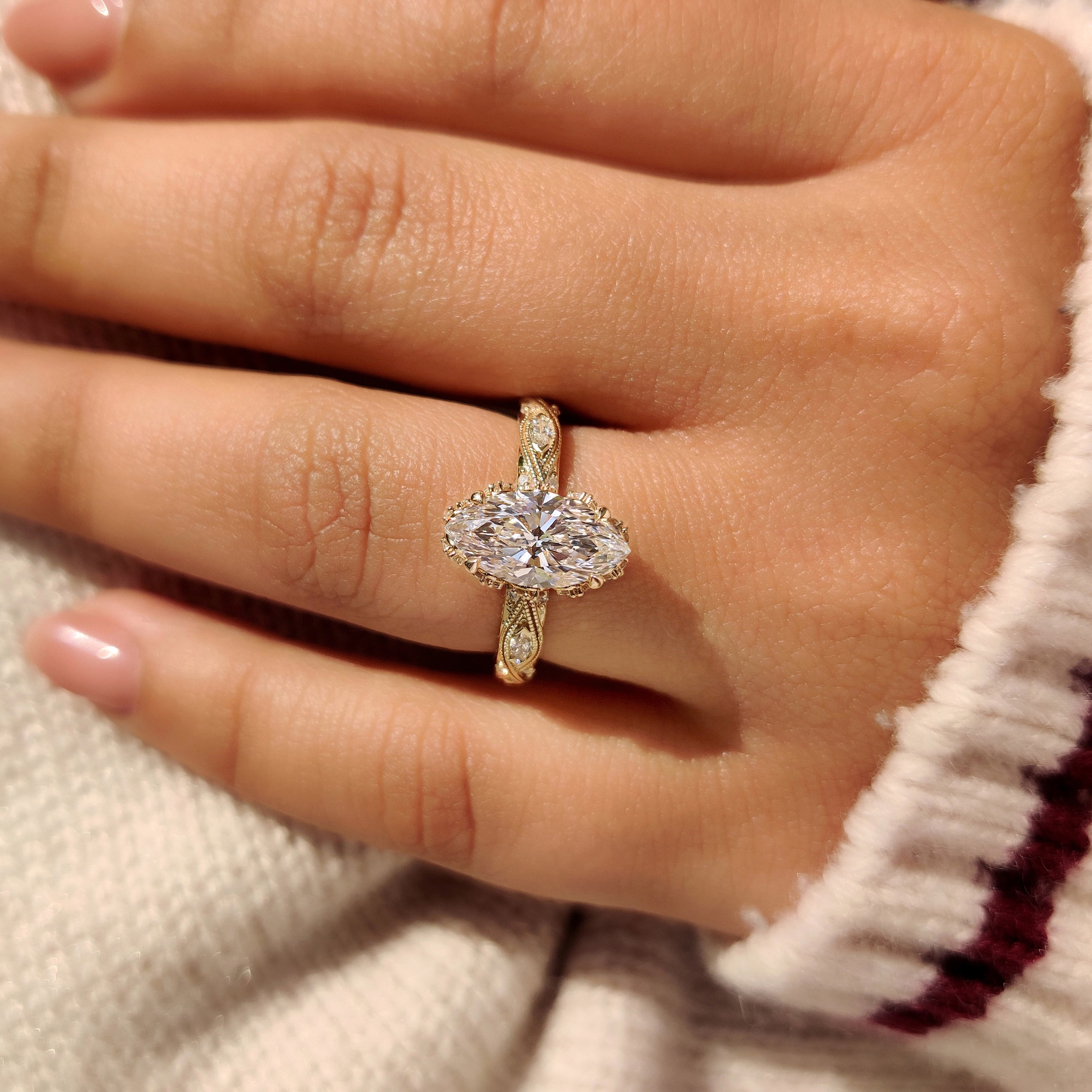Lab grown marquise diamond ring with vintage design.
