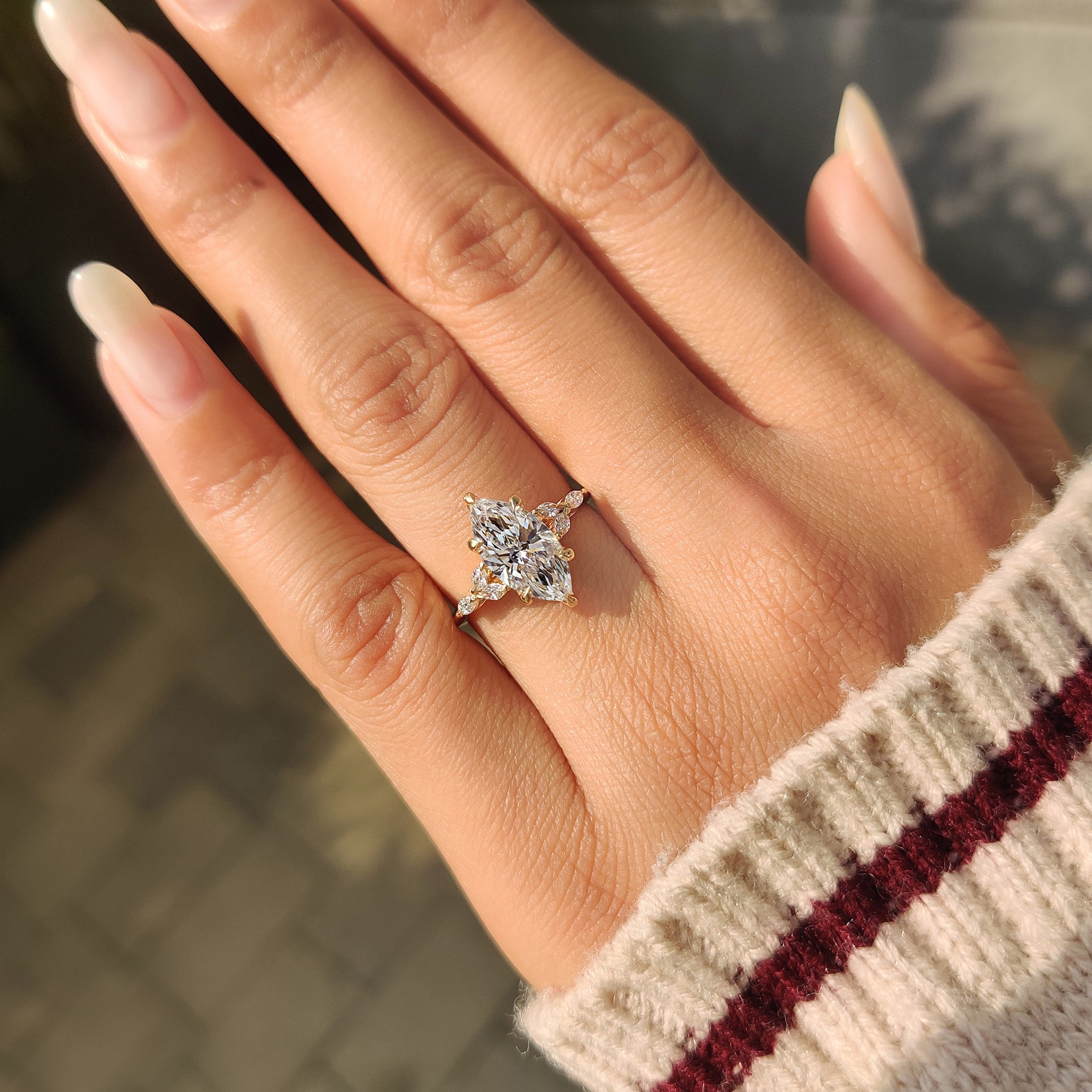 Marquise diamond ring with sharp knife edge band design
