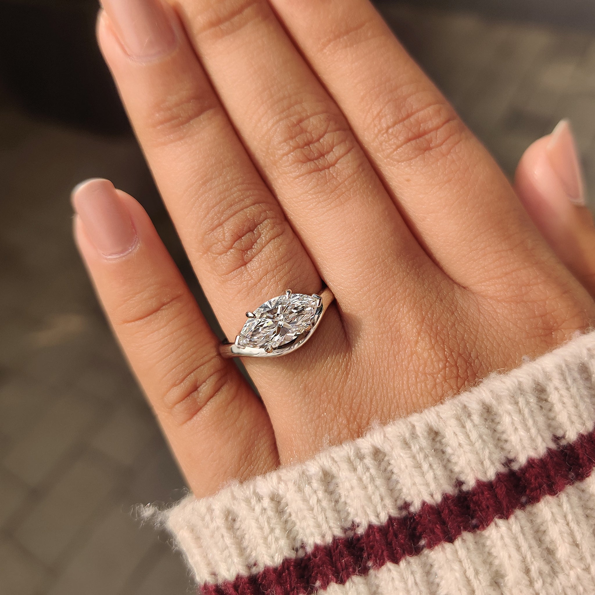 Marquise diamond engagement ring with two V prong and claw prong
