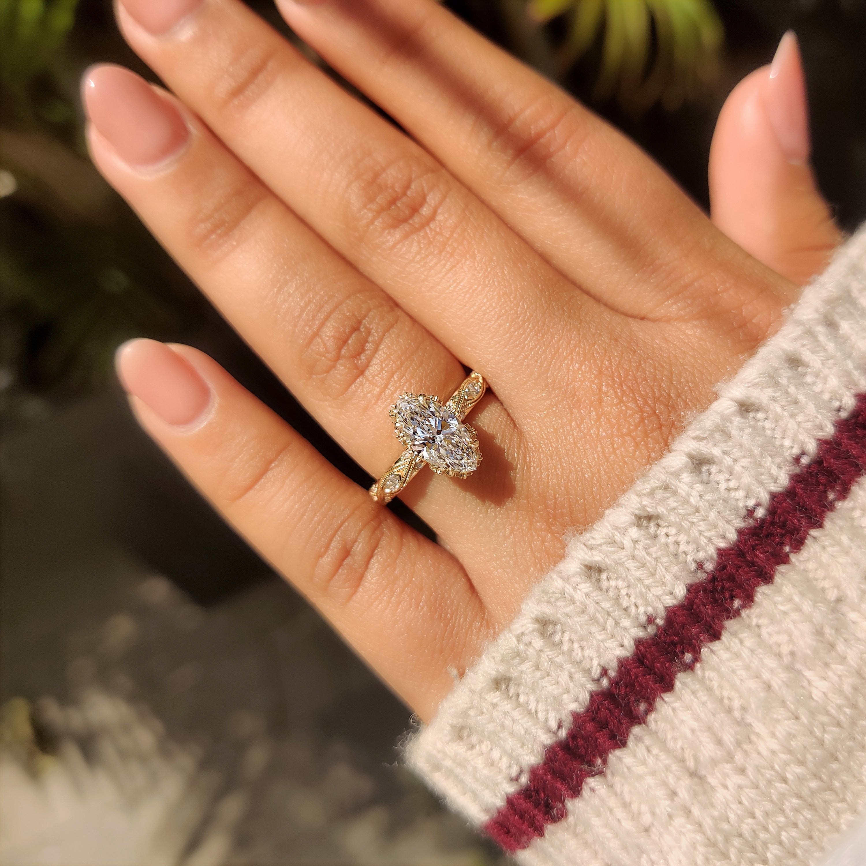 Lab grown marquise diamond ring with filigree shank.
