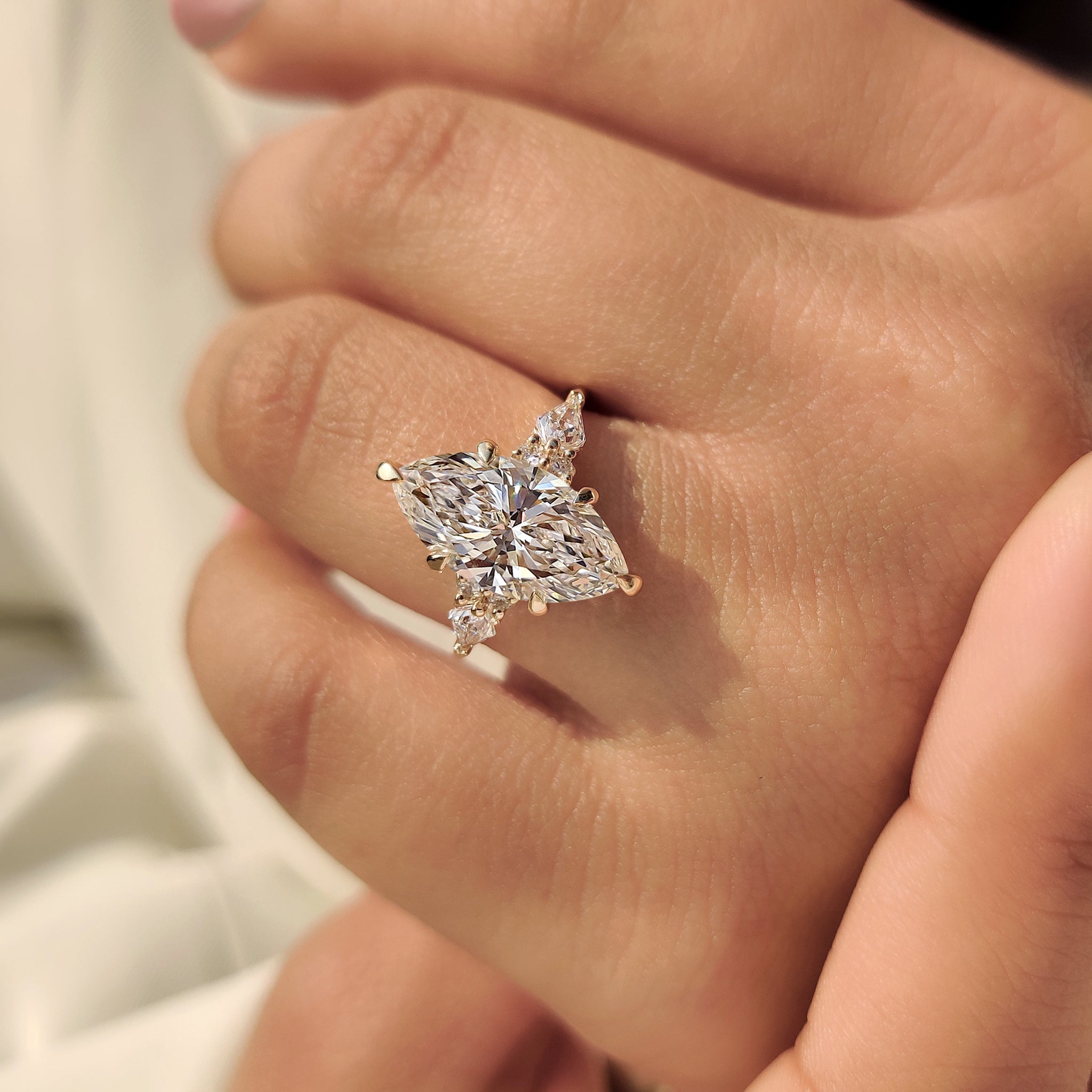 Lab grown diamond marquise ring pinch shank.
