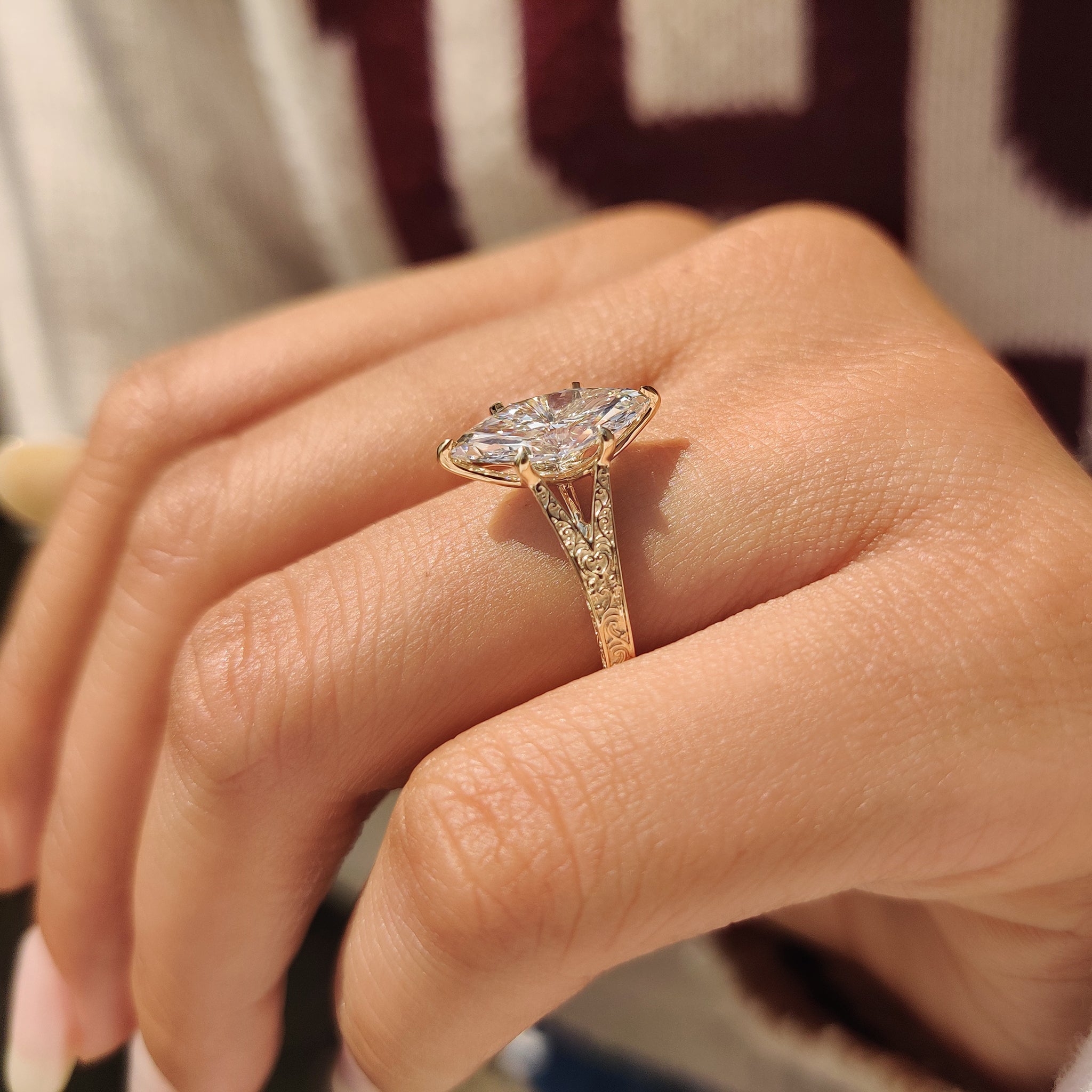 Vintage diamond ring with split shank and detailed filigree design
