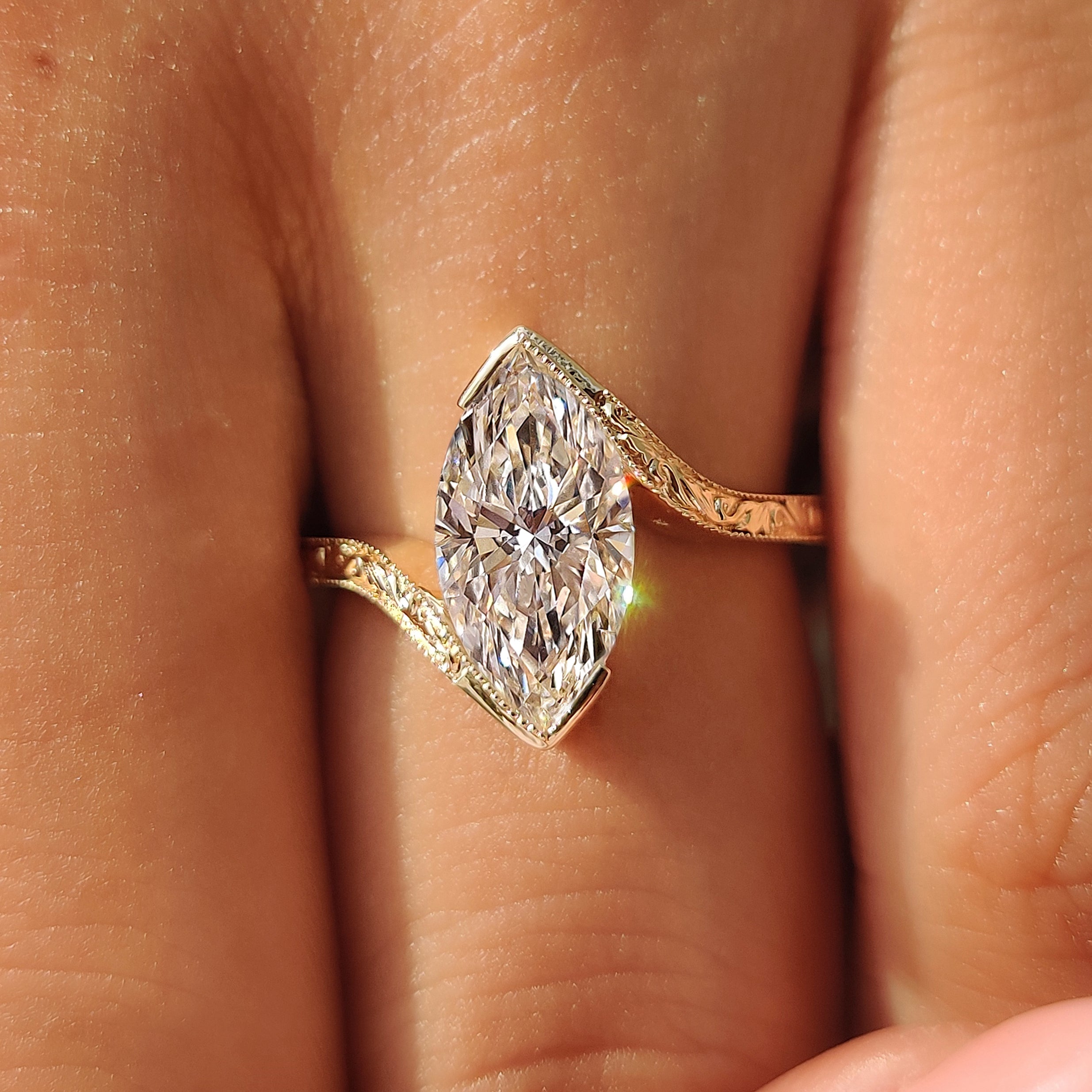Vintage marquise solitaire ring with filigree shank.
