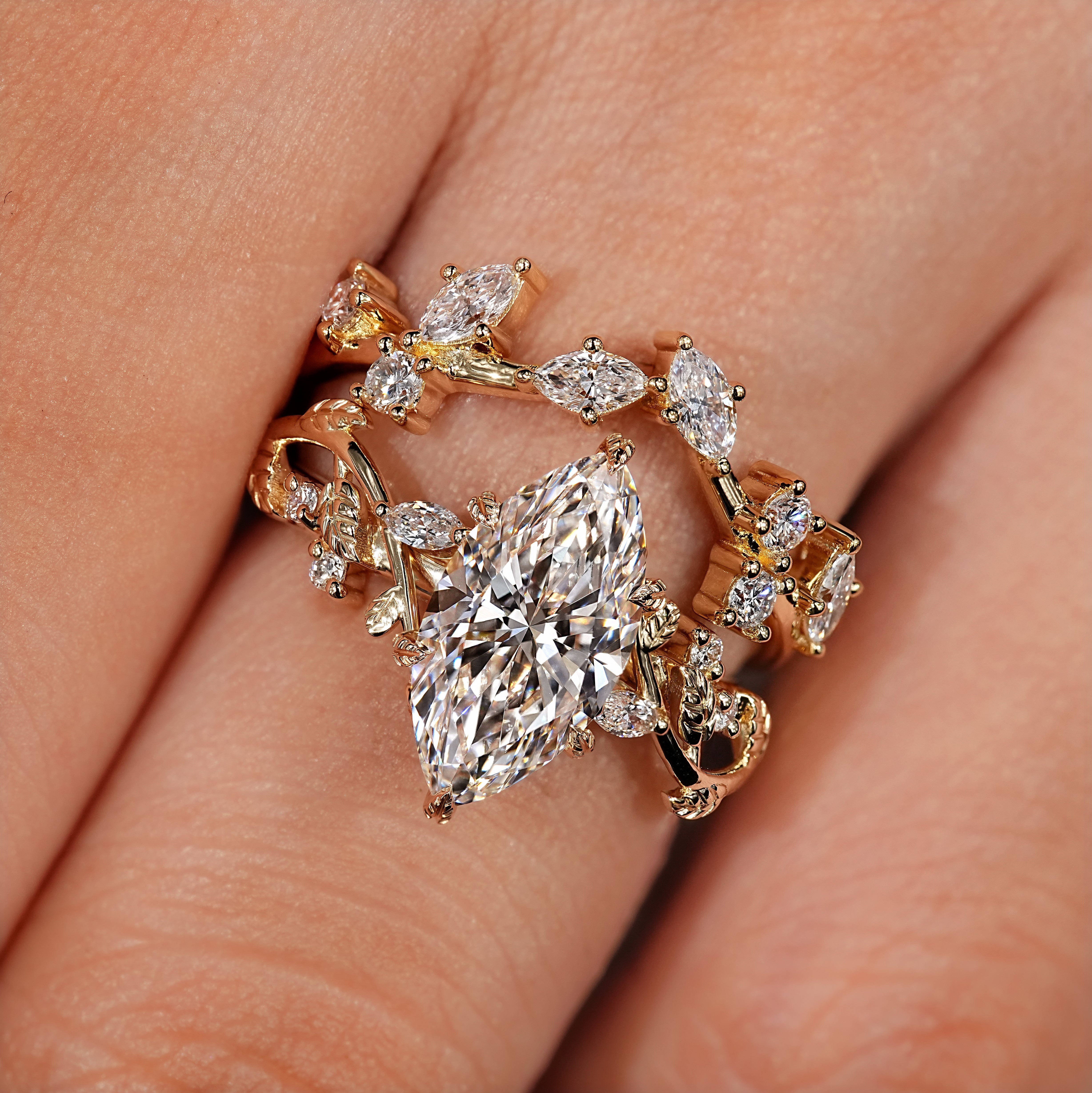 Nature inspired engagement ring with leaf and vine branches.
