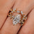 Nature inspired engagement ring with leaf and vine branches.
