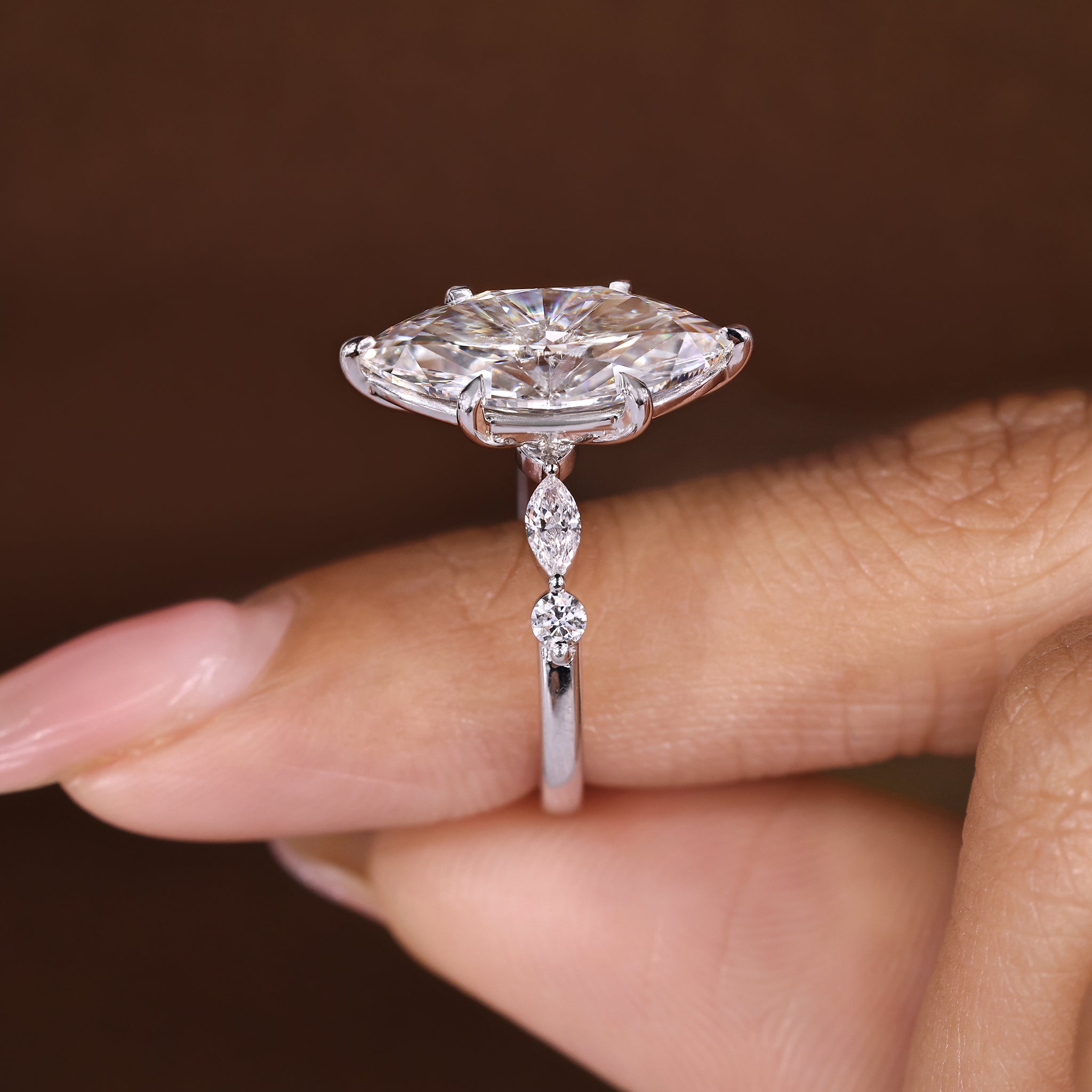 Marquise diamond ring with balanced five stone layout
