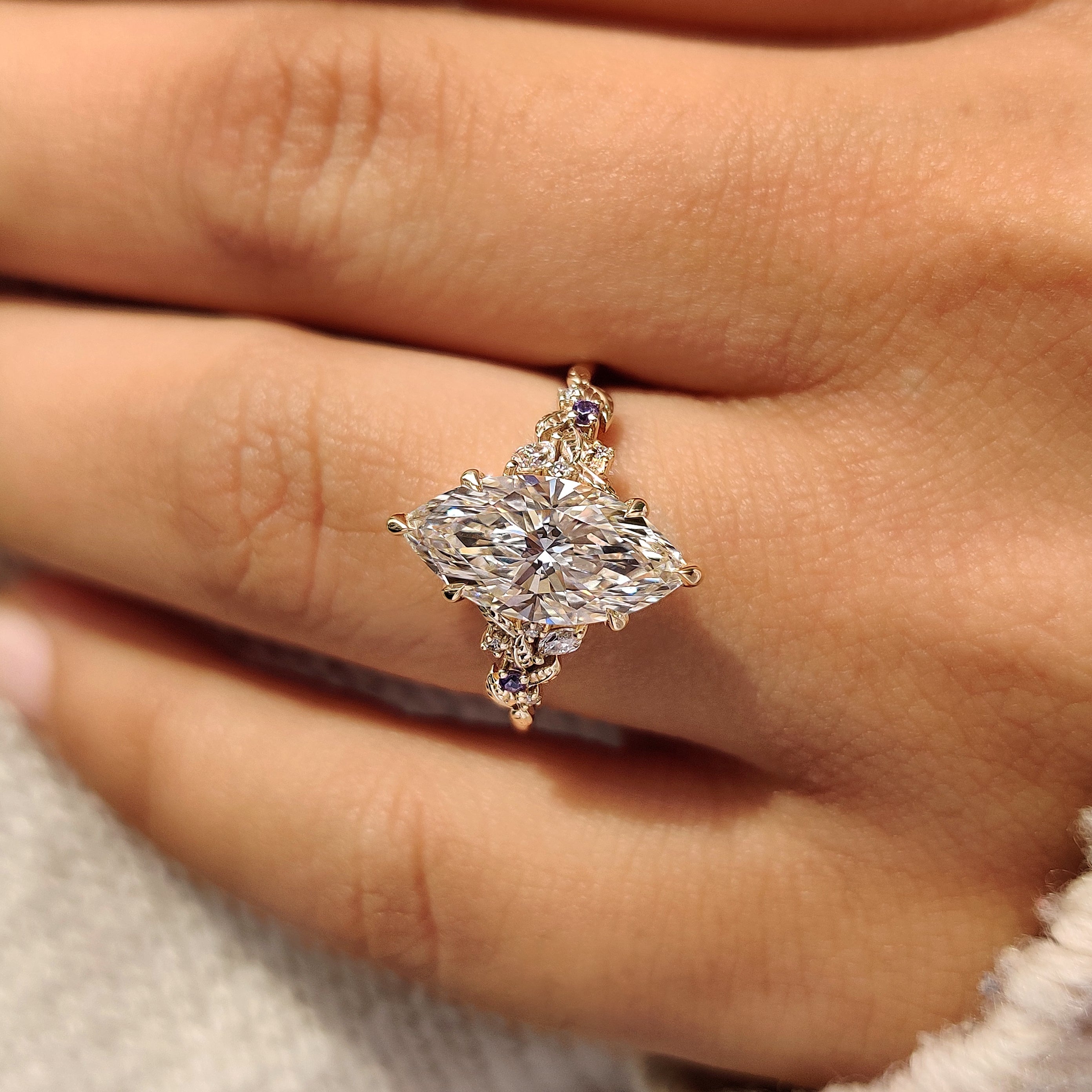 Marquise diamond ring with cluster setting

