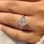 Marquise diamond ring with cluster setting
