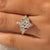 Nature inspired marquise ring with yellow gold band.
