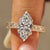Vintage marquise pavé ring with floral and vine shank design.
