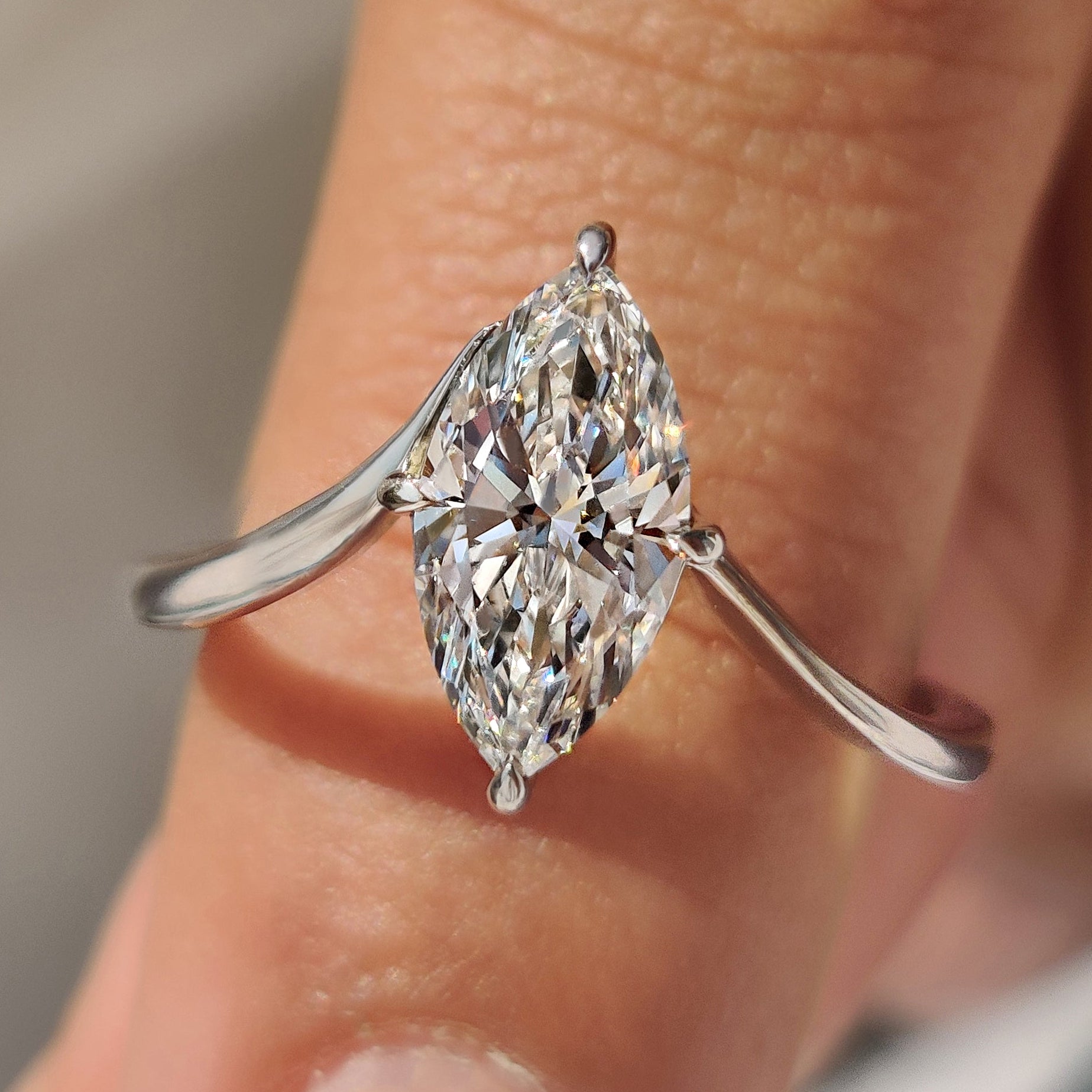 Marquise cut engagement ring with upside down solitaire setting.
