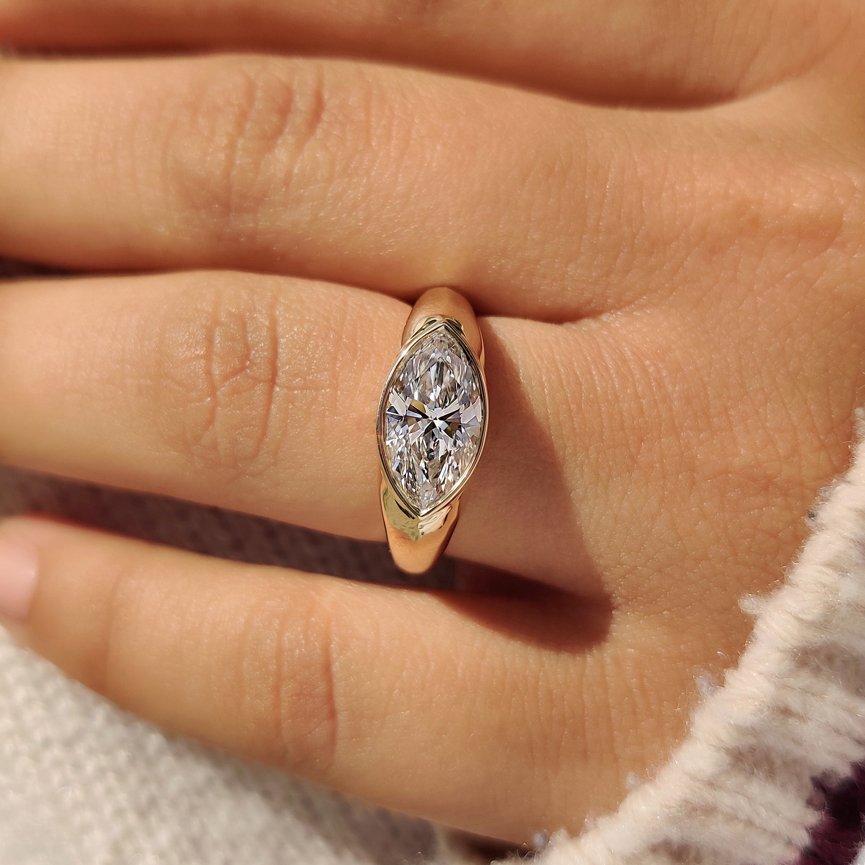 East west marquise diamond ring with wide band
