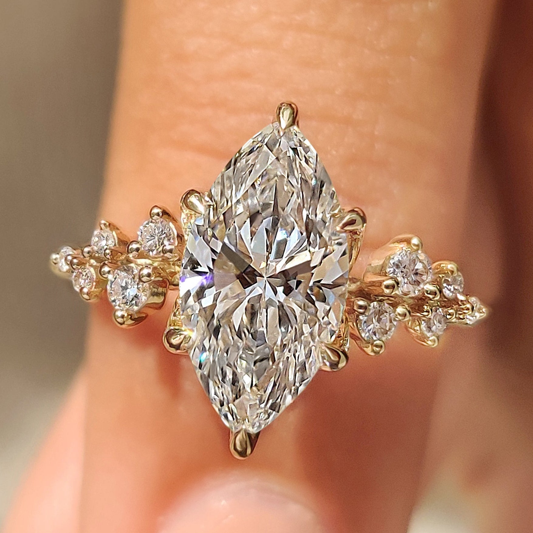 Marquise Engagement Ring in Muse Setting with round side stones
