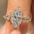Marquise Engagement Ring in Muse Setting with round side stones
