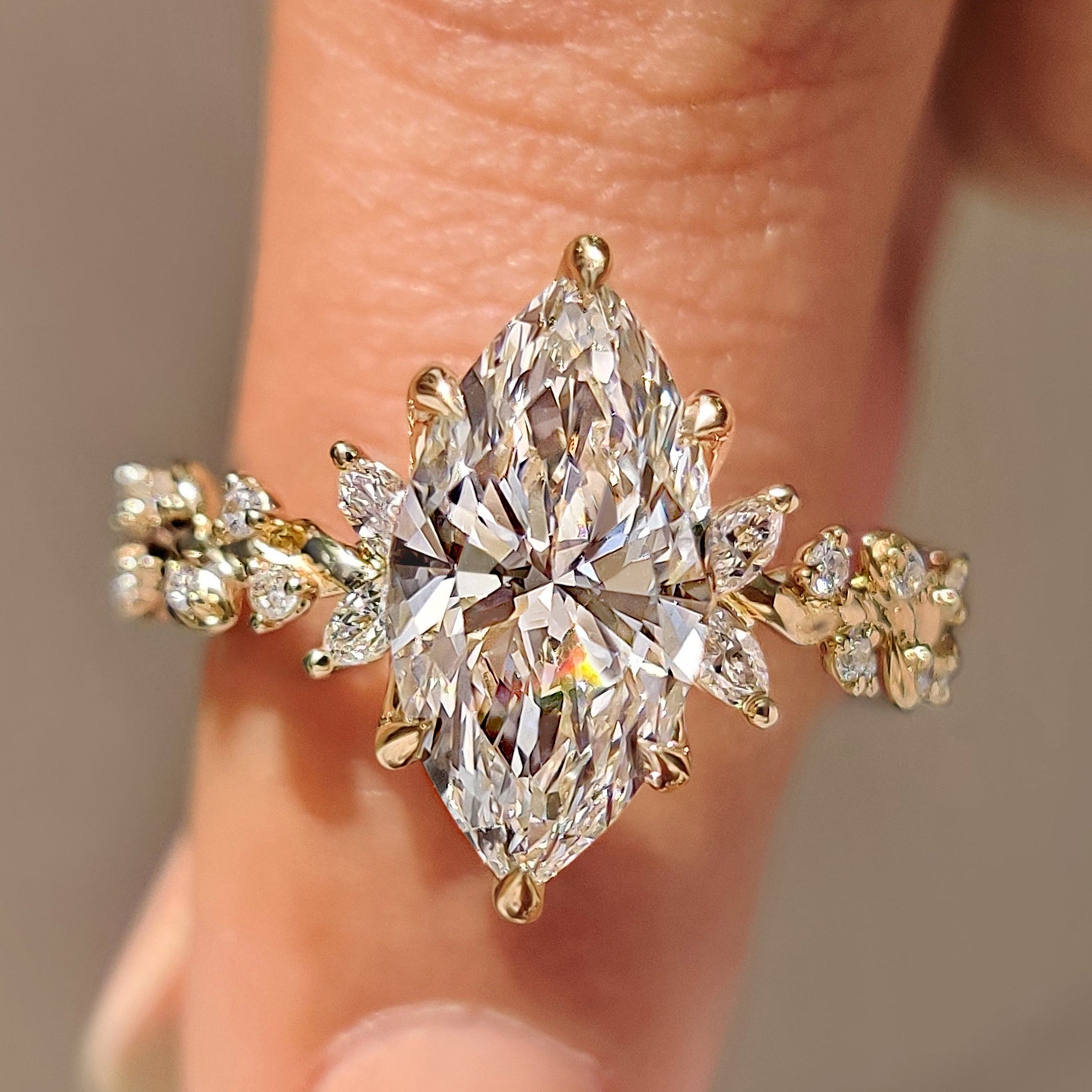 Marquise diamond ring with nature inspired cluster design
