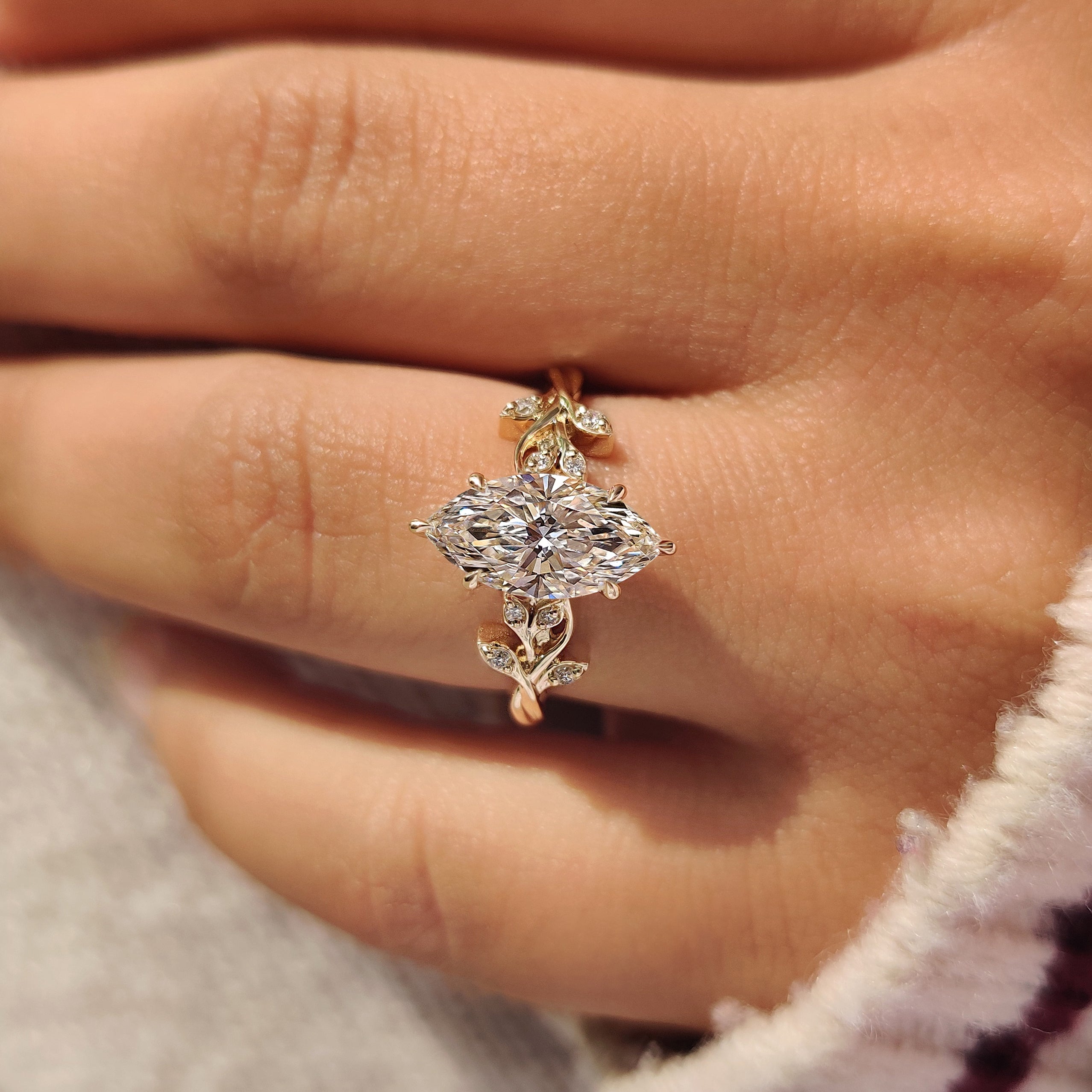 Cathedral marquise diamond ring with six prongs.
