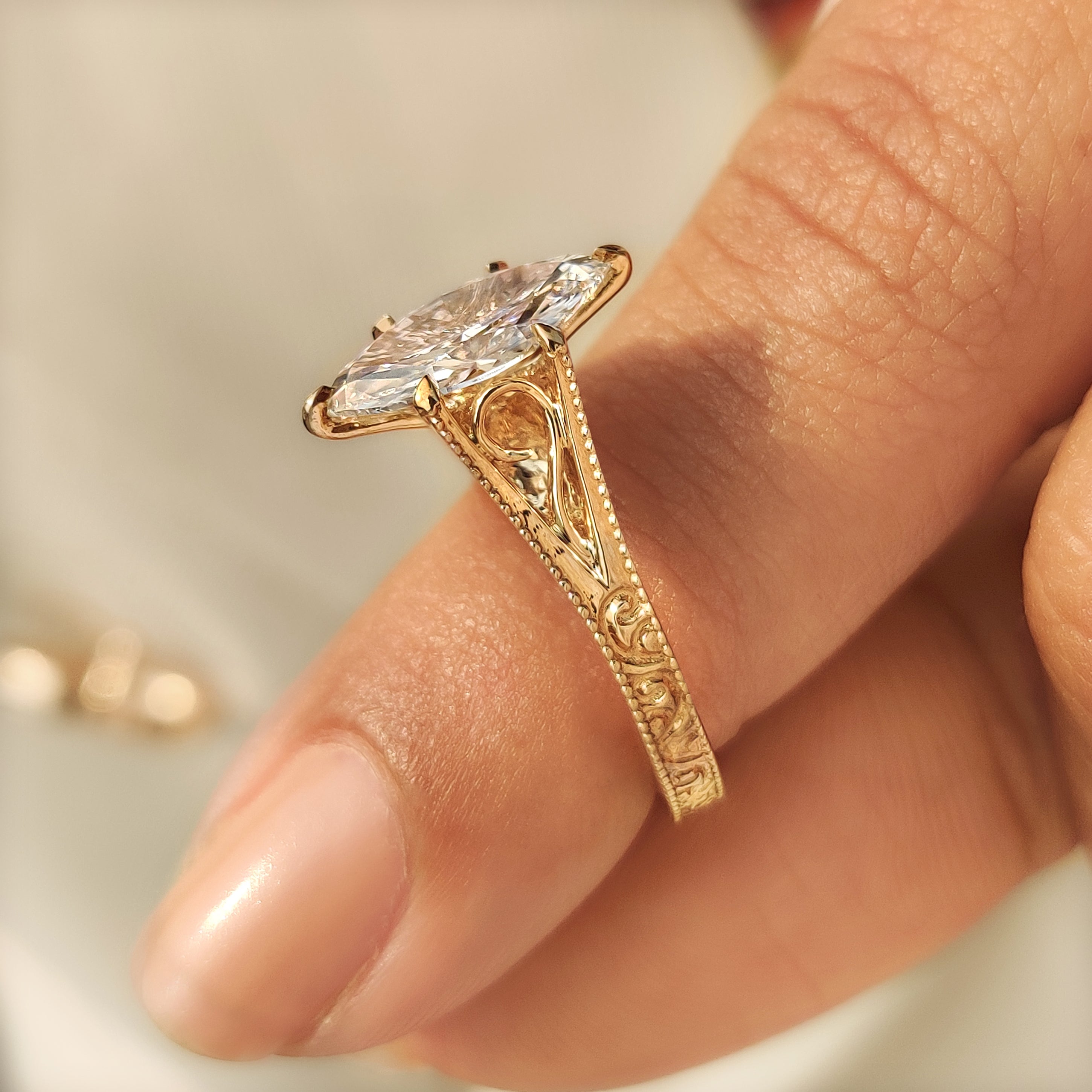 Carat Diamonds marquise ring with vintage milgrain detailing.
